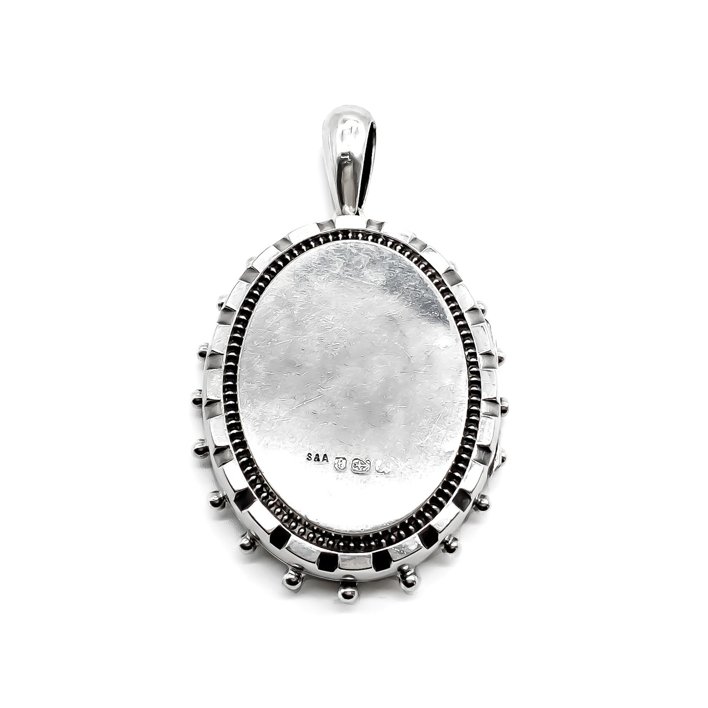 Ornate Victorian sterling silver locket with beautiful floral engraving.