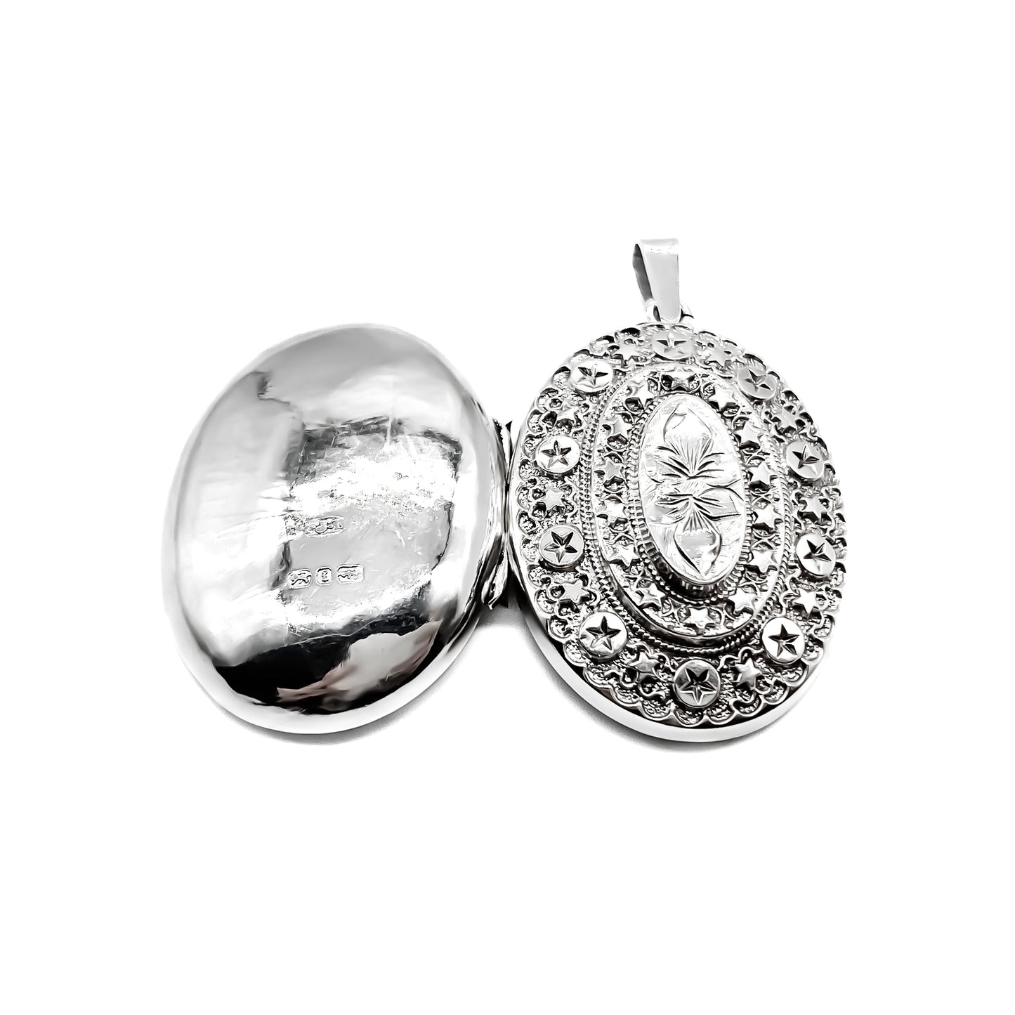 Very pretty ornate Victorian oval sterling silver locket.