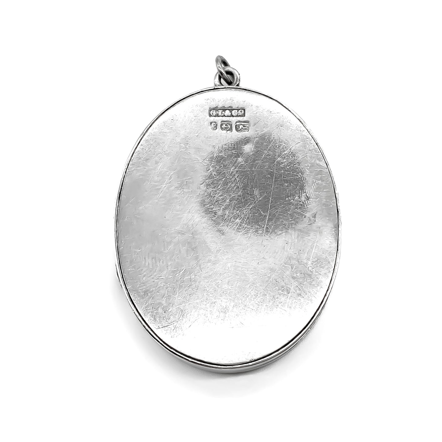 Beautifully engraved Victorian sterling silver oval locket. Maker: GL and CO.