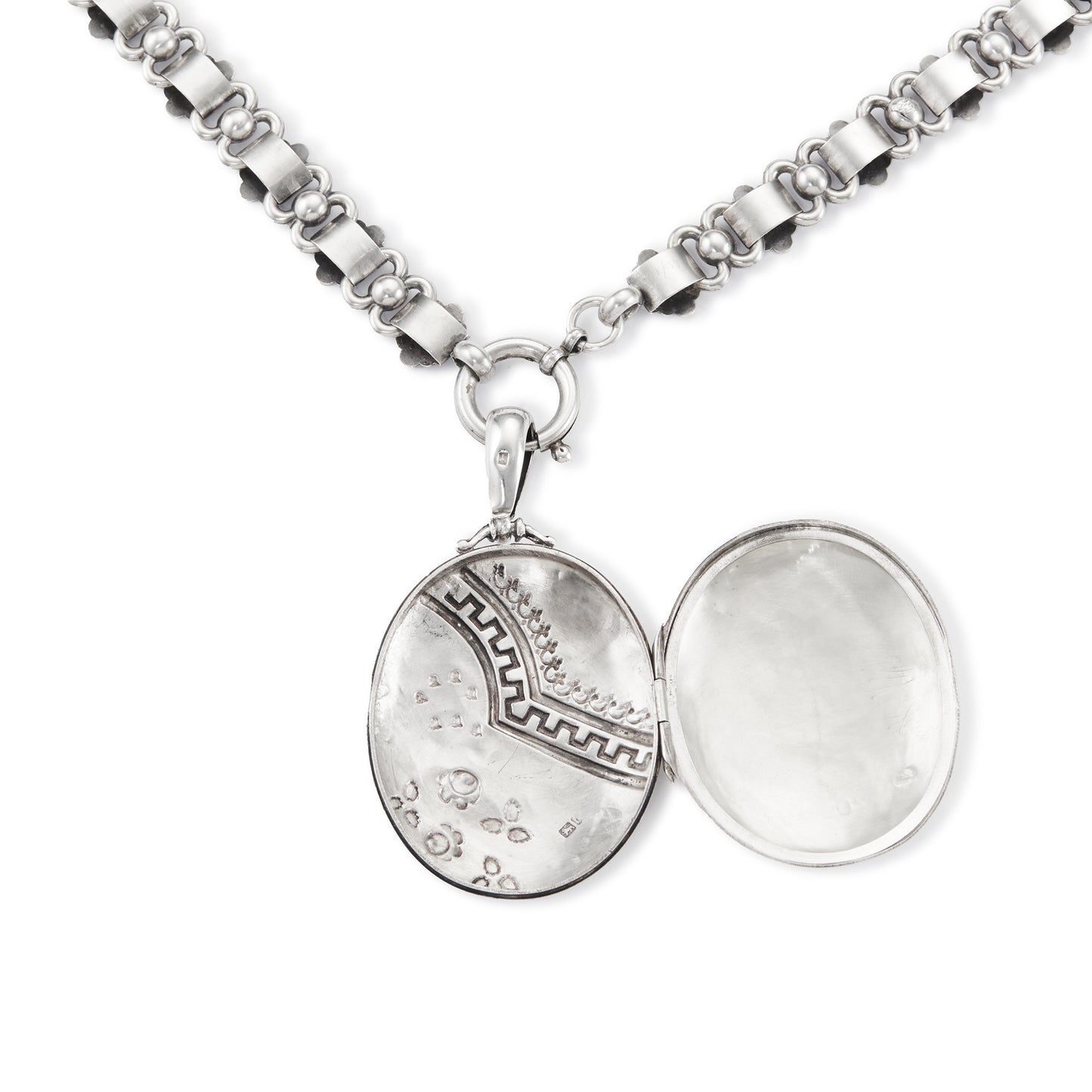 Beautiful Victorian sterling silver locket with intricate detail on an ornate sterling silver chain. Faint inscription at the back of the locket.