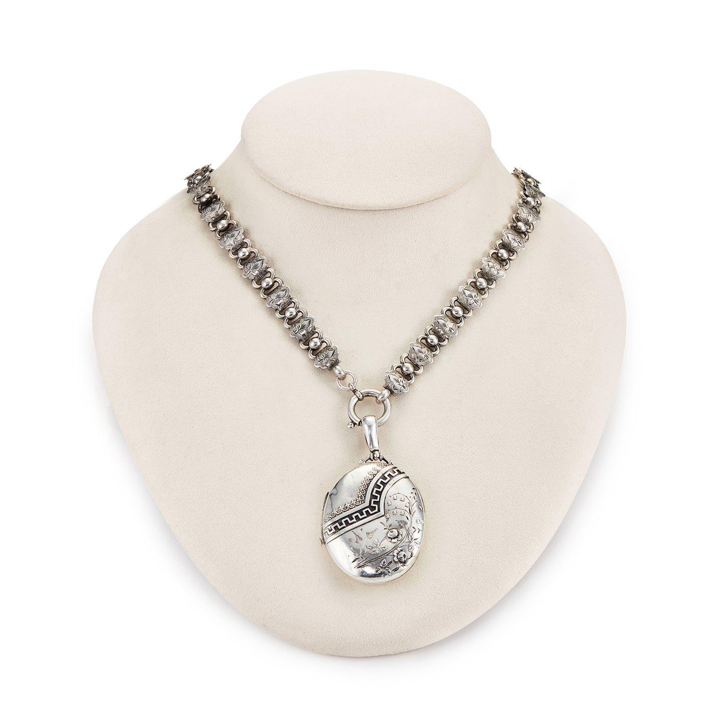 Beautiful Victorian sterling silver locket with intricate detail on an ornate sterling silver chain. Faint inscription at the back of the locket.