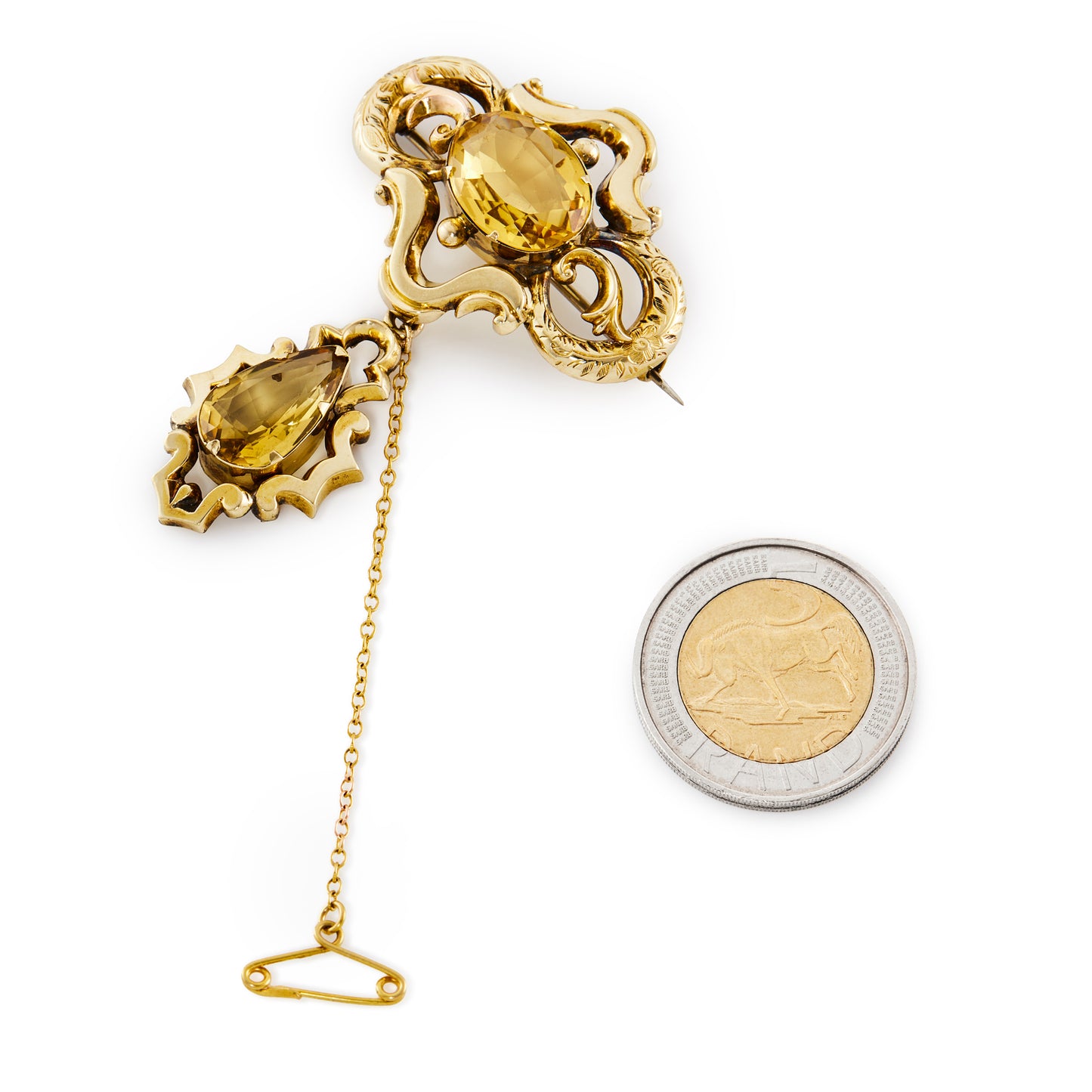 Exquisite 9ct gold Victorian brooch set with two beautifully faceted, golden colour citrines, one in a dangling drop. Dated 1852.