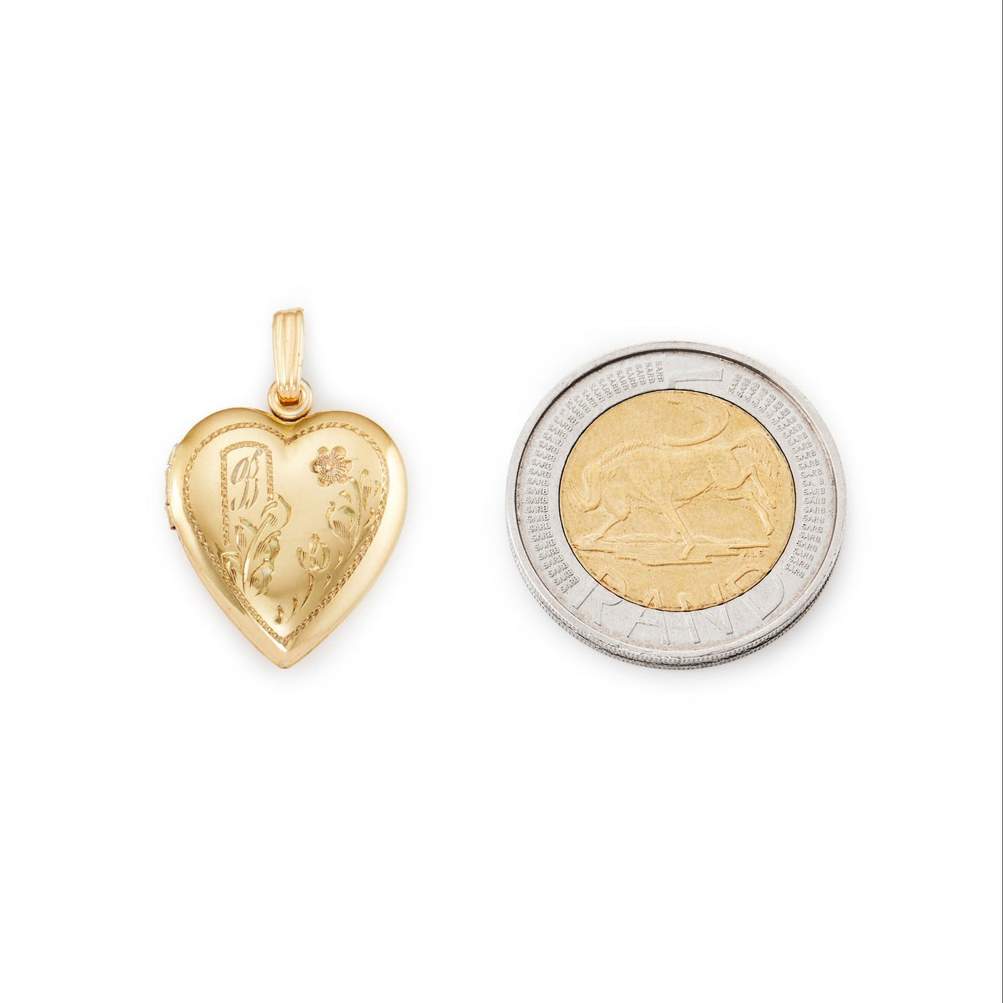 Quaint vintage 12ct gold on sterling silver heart locked with beautiful floral engraving and the initial B. The locket holds two photographs.