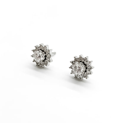 Stylish vintage 18ct white gold flower stud earrings with diamonds in a tier setting.