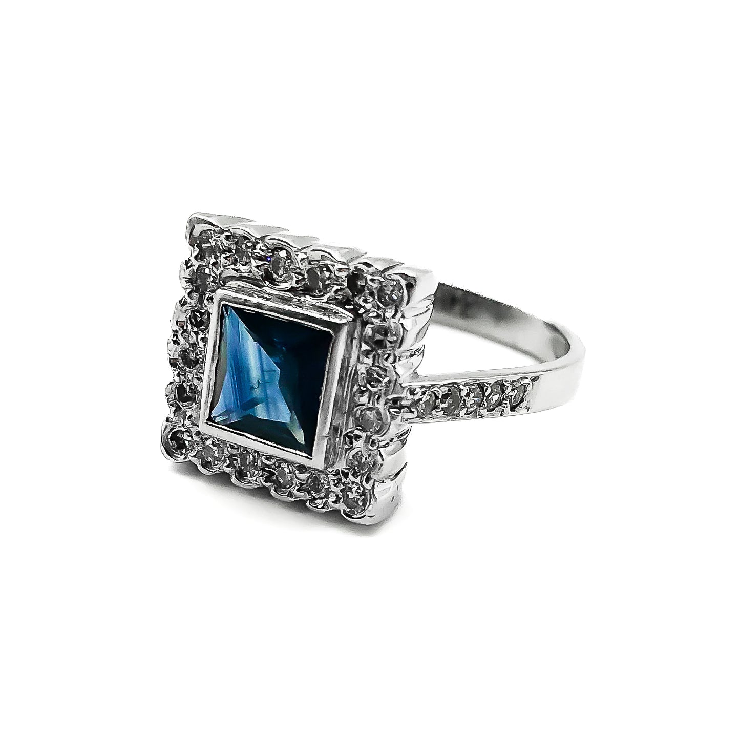 Stunning Art Deco style 18ct white gold ring with a square sapphire surrounded by twenty diamonds and ten smaller diamonds on the shank.
