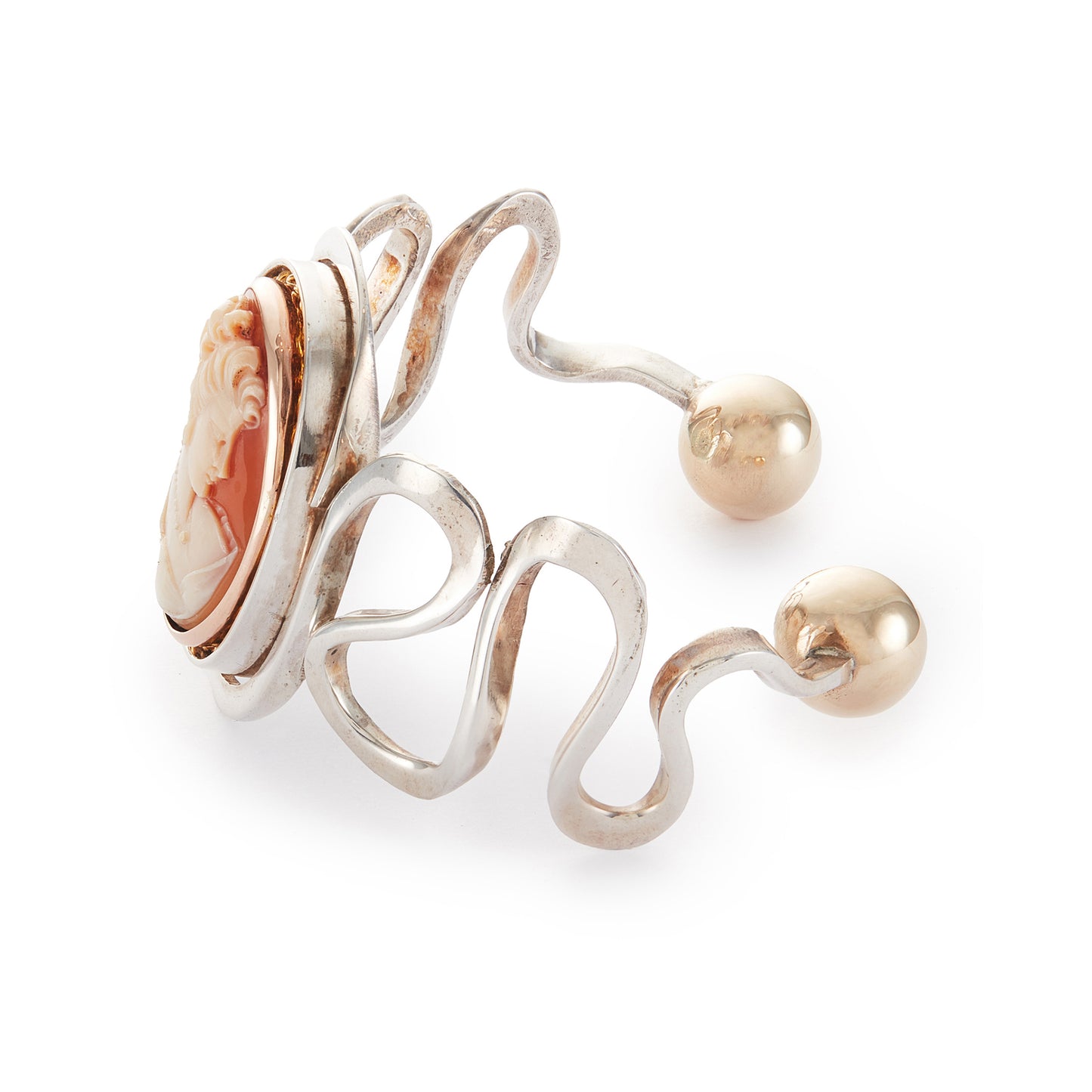 Beautifully handcrafted vintage designer sterling silver bangle with a classic cameo in a 9ct rose gold frame and 9ct rose gold beads at the opening. Will fit most wrists.