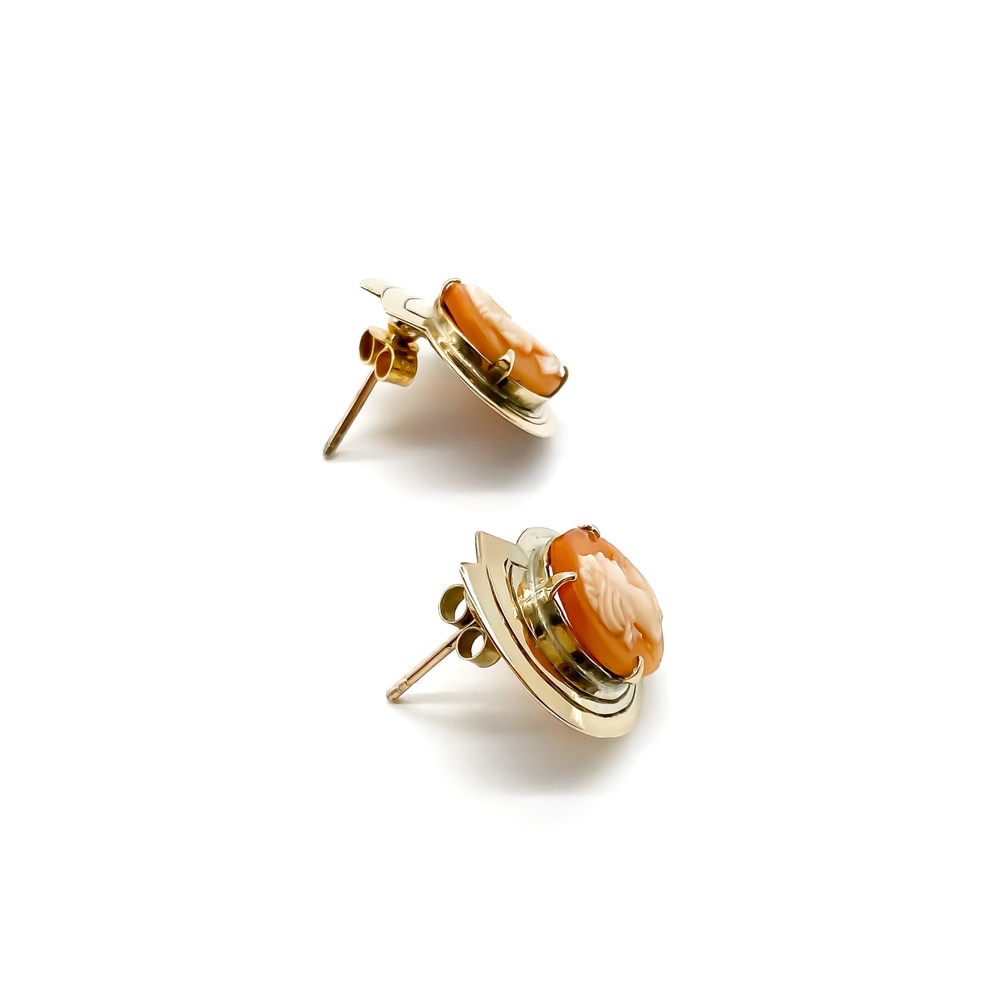 Stylish vintage 9ct rose gold stud earrings set with two beautifully carved cameos.