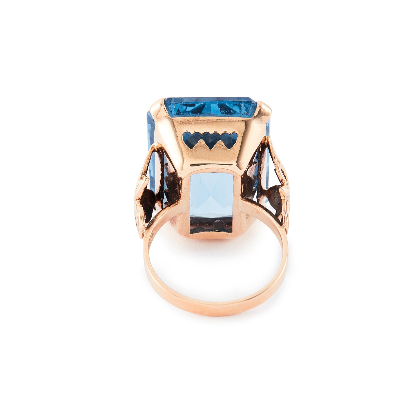Beautifully faceted deep-blue lab-grown spinel in a lovely 9ct rose gold ring setting with a leaf design.