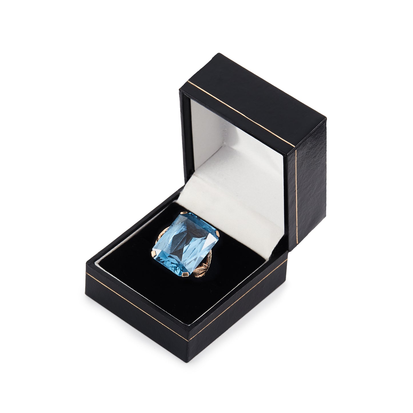 Beautifully faceted deep-blue lab-grown spinel in a lovely 9ct rose gold ring setting with a leaf design.