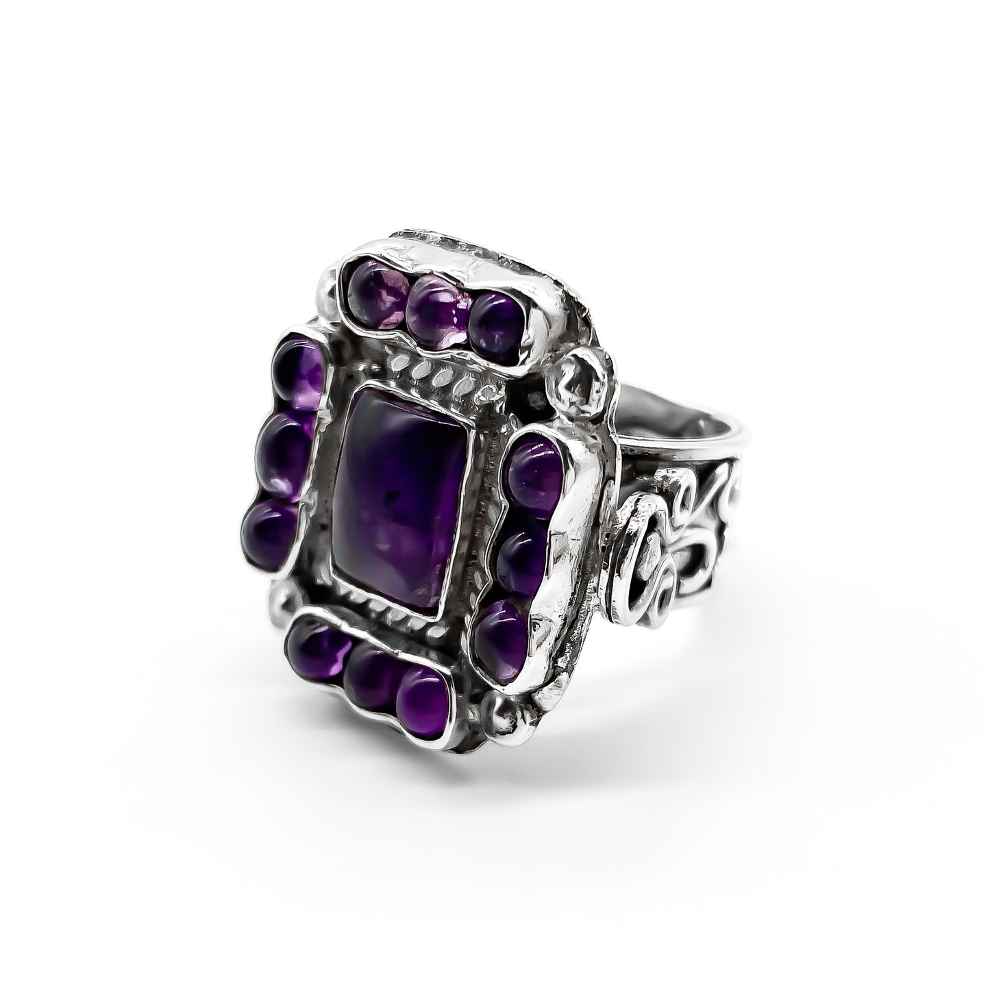 Charming vintage Mexican sterling silver ring set with deep purple cabochon amethysts.