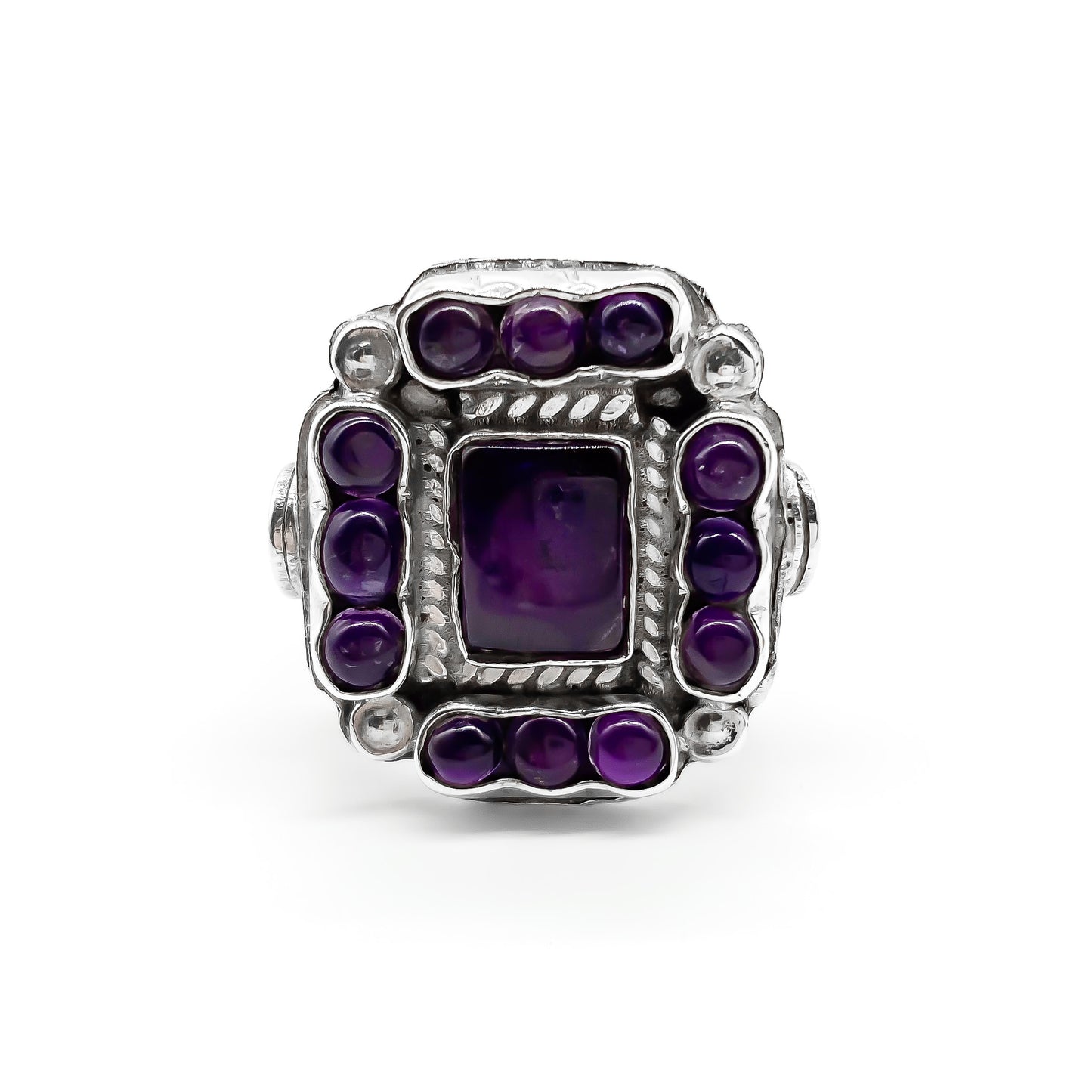 Charming vintage Mexican sterling silver ring set with deep purple cabochon amethysts.