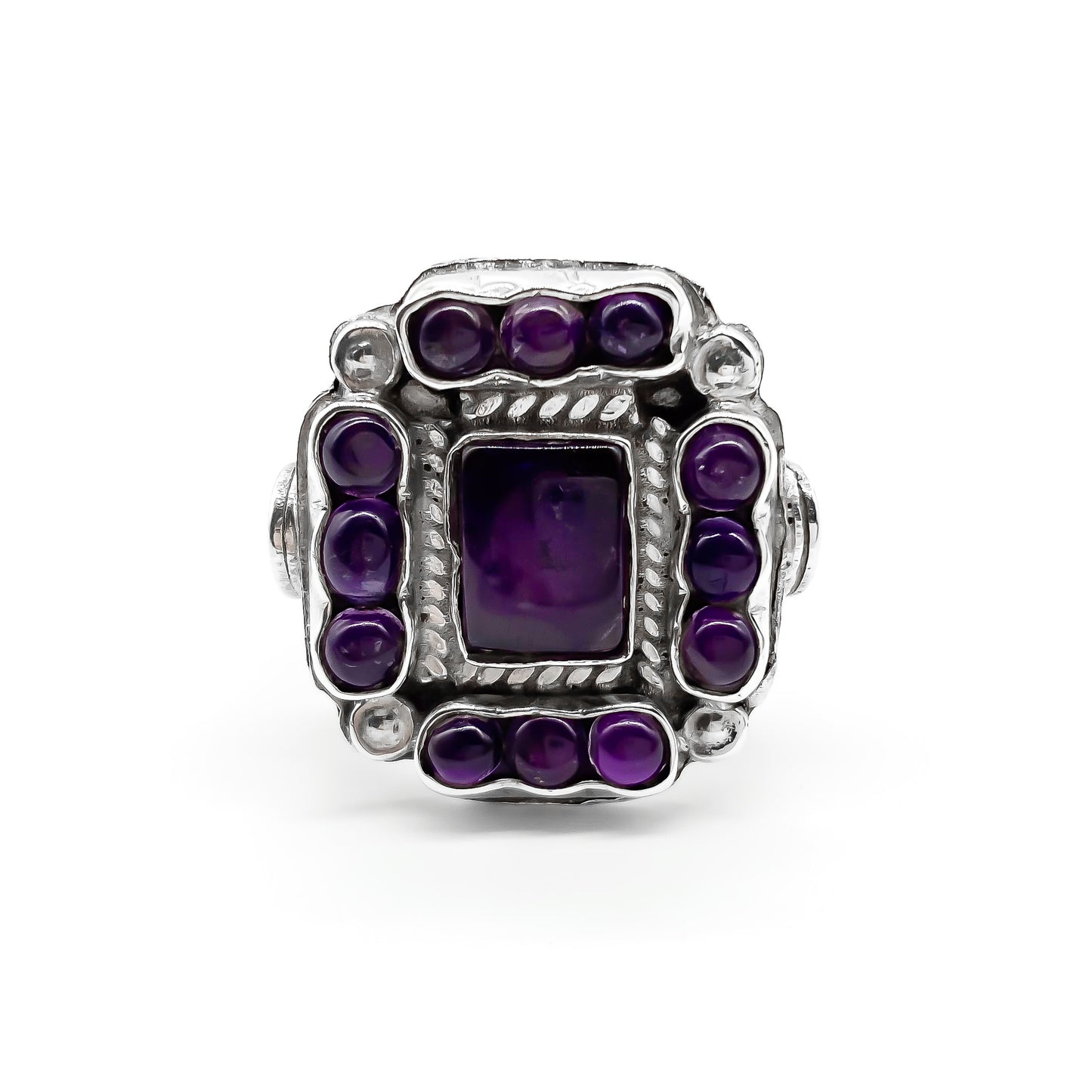 Charming vintage Mexican sterling silver ring set with deep purple cabochon amethysts. 