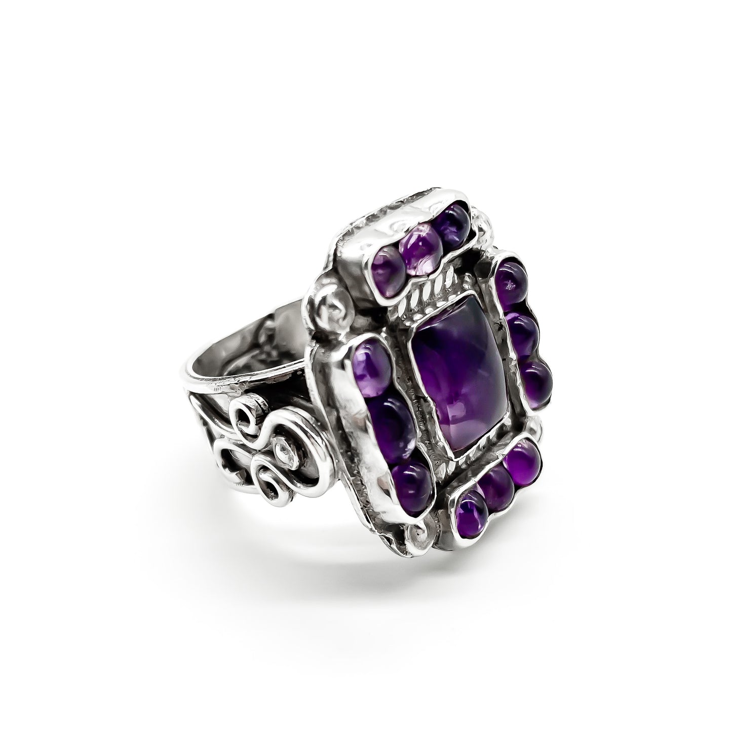 Charming vintage Mexican sterling silver ring set with deep purple cabochon amethysts. 
