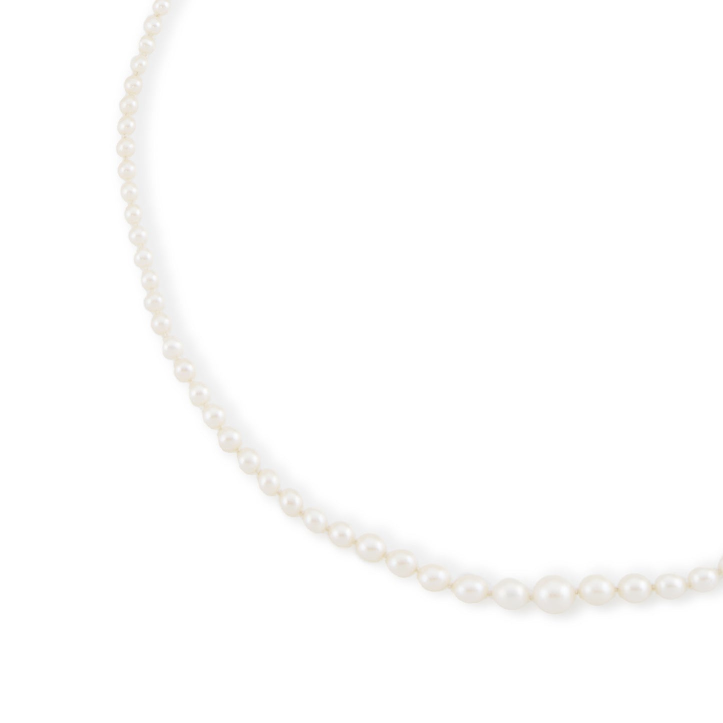 Lustrous graduated string of vintage cultured seawater pearls with a 14ct gold filigree clasp.