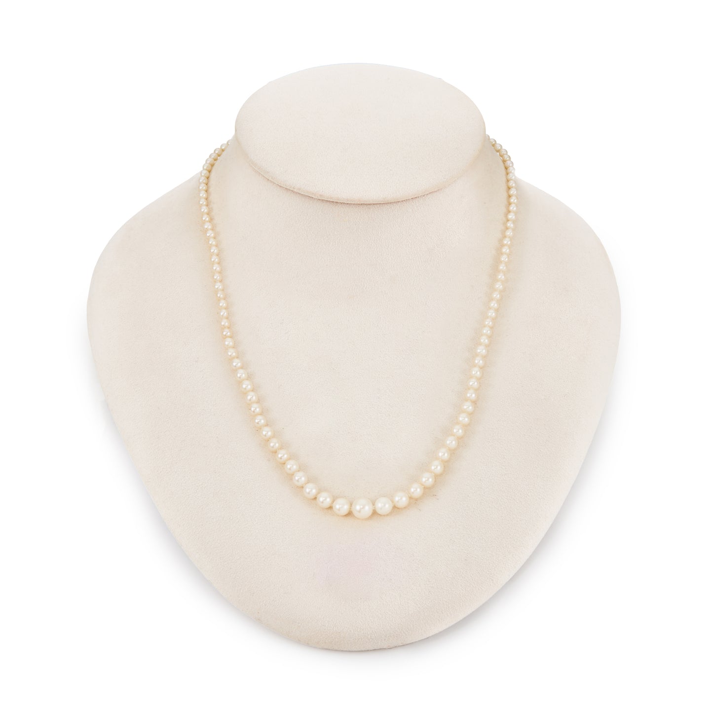 Graduated string of lustrous vintage cultured seawater pearls with sterling silver clasp set with a single pearl.