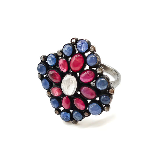 Gorgeous vintage oxidised sterling silver ring set with cabochon sapphires, rubies, a centre moonstone and tiny old-cut diamonds.