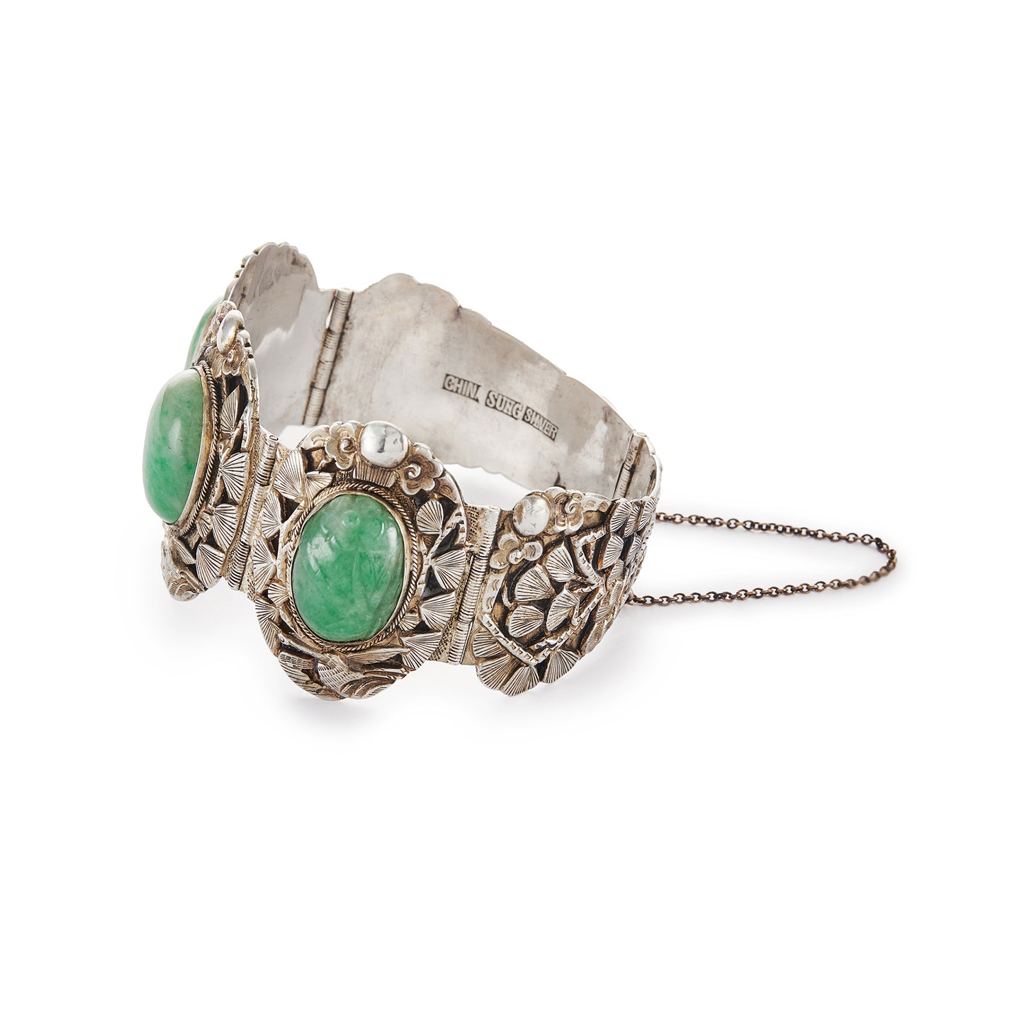 Stunning Chinese silver gilt bracelet set with three oval jade cabochon stones. Two side stones are hand carved with a leaf design. The bracelet is ornately carved with a floral design, also featuring birds and a dragon.