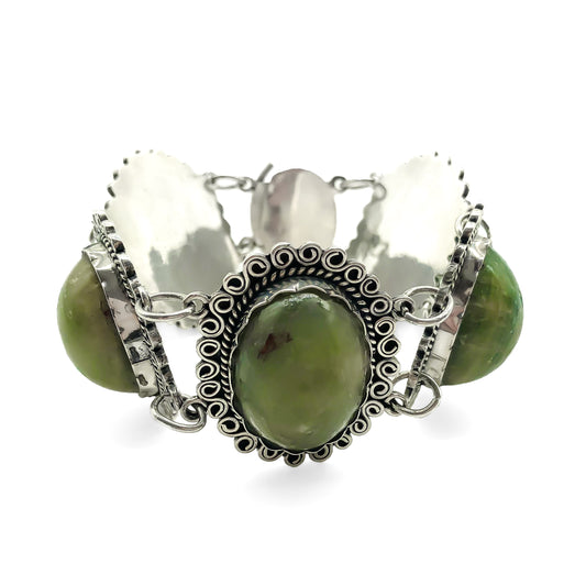 Lovely vintage silver Mexican bracelet set with natural green cabochon gemstones.  Circa 1940’s