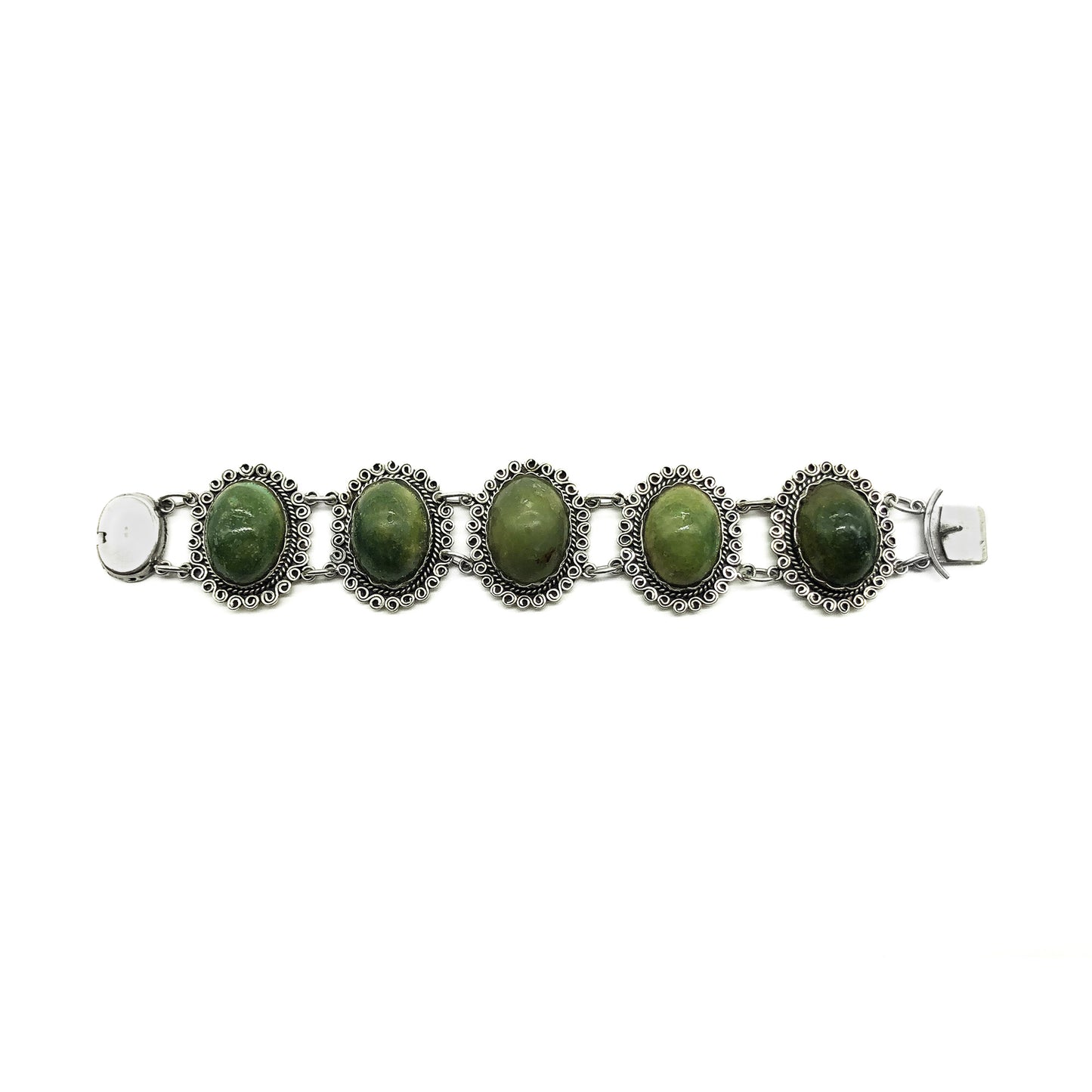 Lovely vintage silver Mexican bracelet set with natural green cabochon gemstones. Circa 1940’s