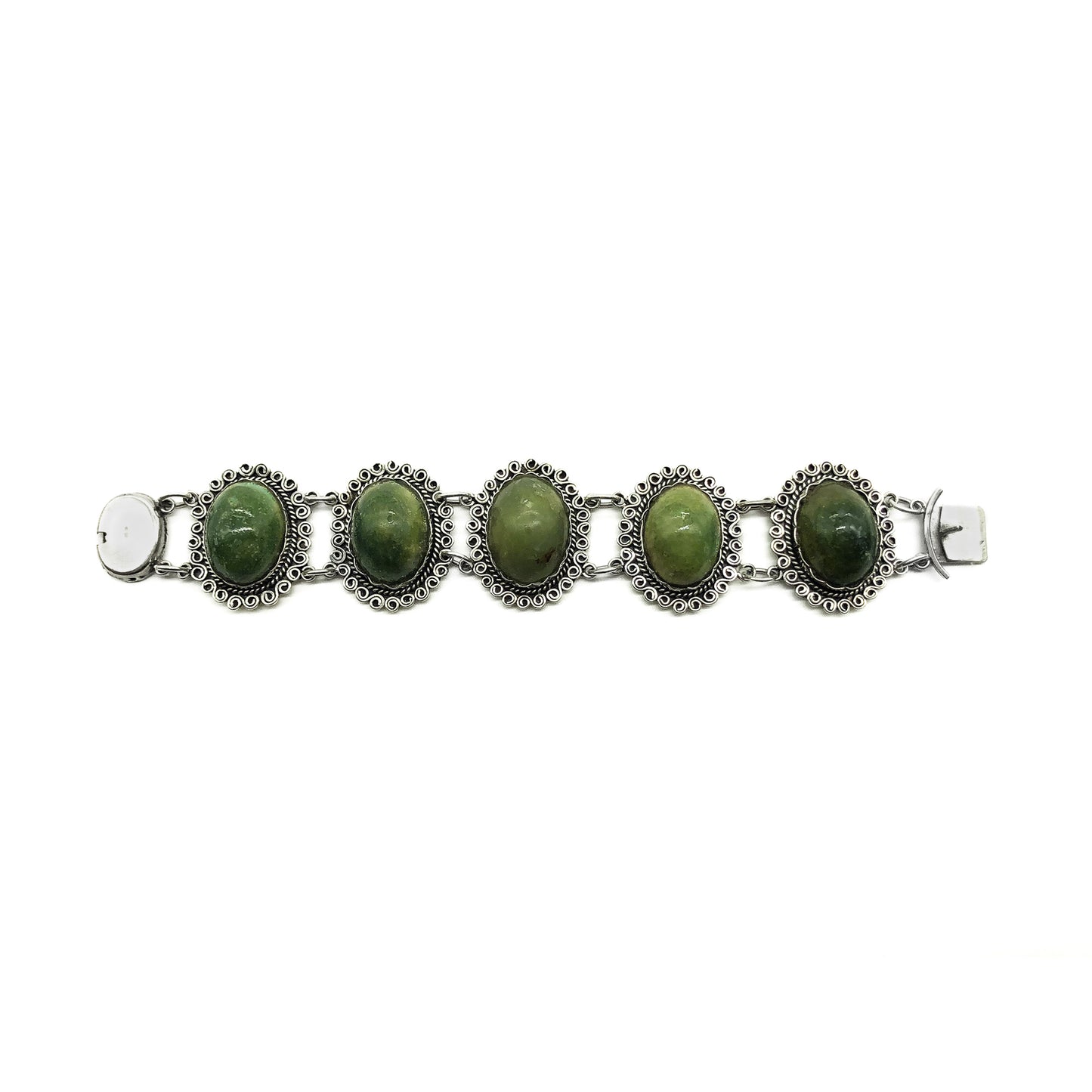 Lovely vintage silver Mexican bracelet set with natural green cabochon gemstones.  Circa 1940’s