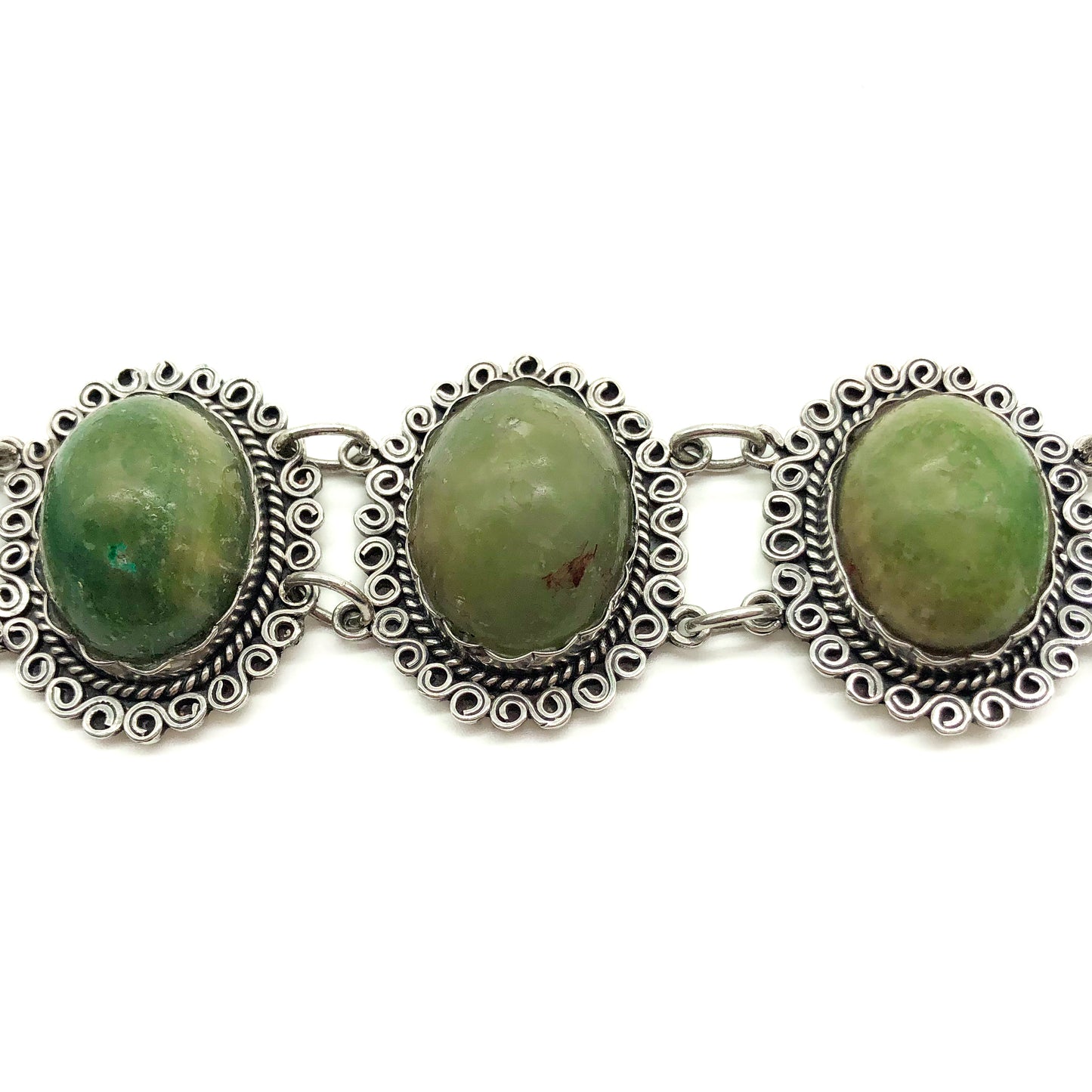 Lovely vintage silver Mexican bracelet set with natural green cabochon gemstones. Circa 1940’s