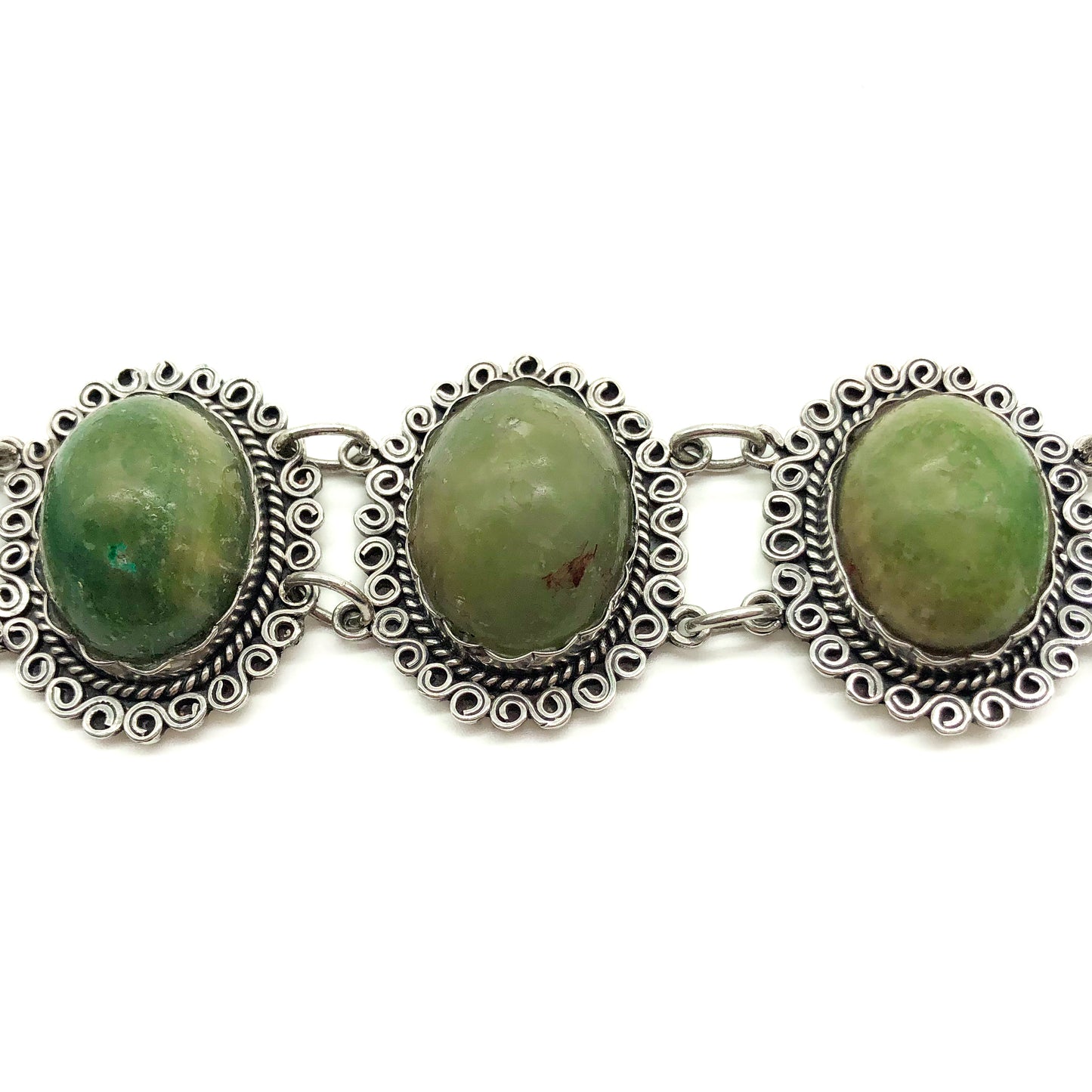 Lovely vintage silver Mexican bracelet set with natural green cabochon gemstones.  Circa 1940’s