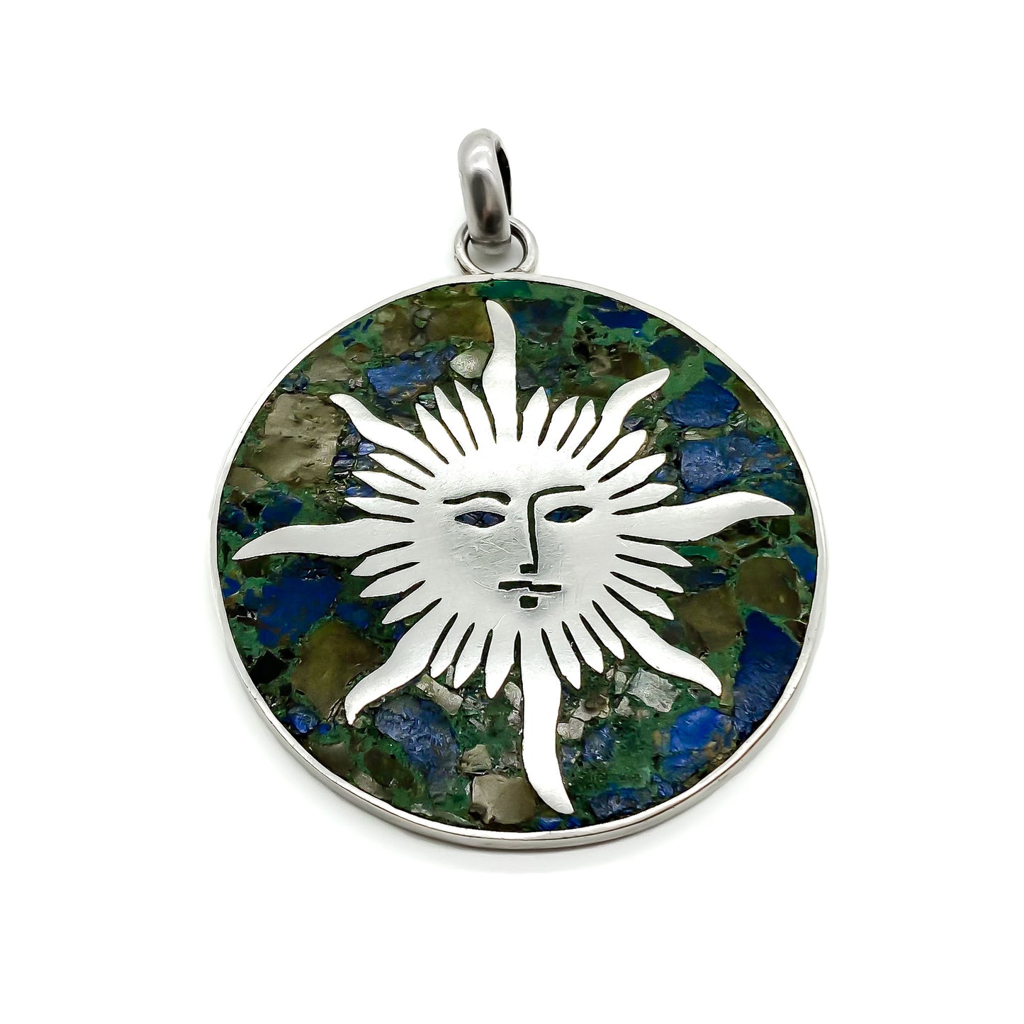 Vintage silver pendant with crushed stone inlay and sun face design. Made in Taxco.