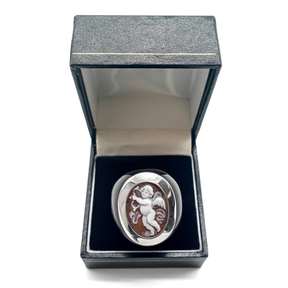 Sterling silver and horn vintage ring set with an exquisite cameo depicting a cherub with an arrow and a bow.