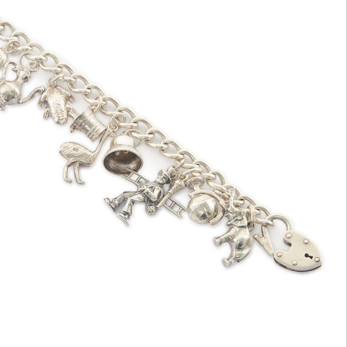 Chunky vintage sterling silver curb link bracelet with seventeen whimsical charms and a heavy padlock. The bracelet has a nice weight to it.