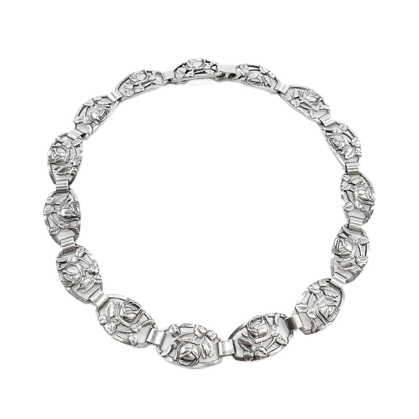 Ornate Danish sterling silver choker with fifteen links, each depicting a rose surrounded by leaves.