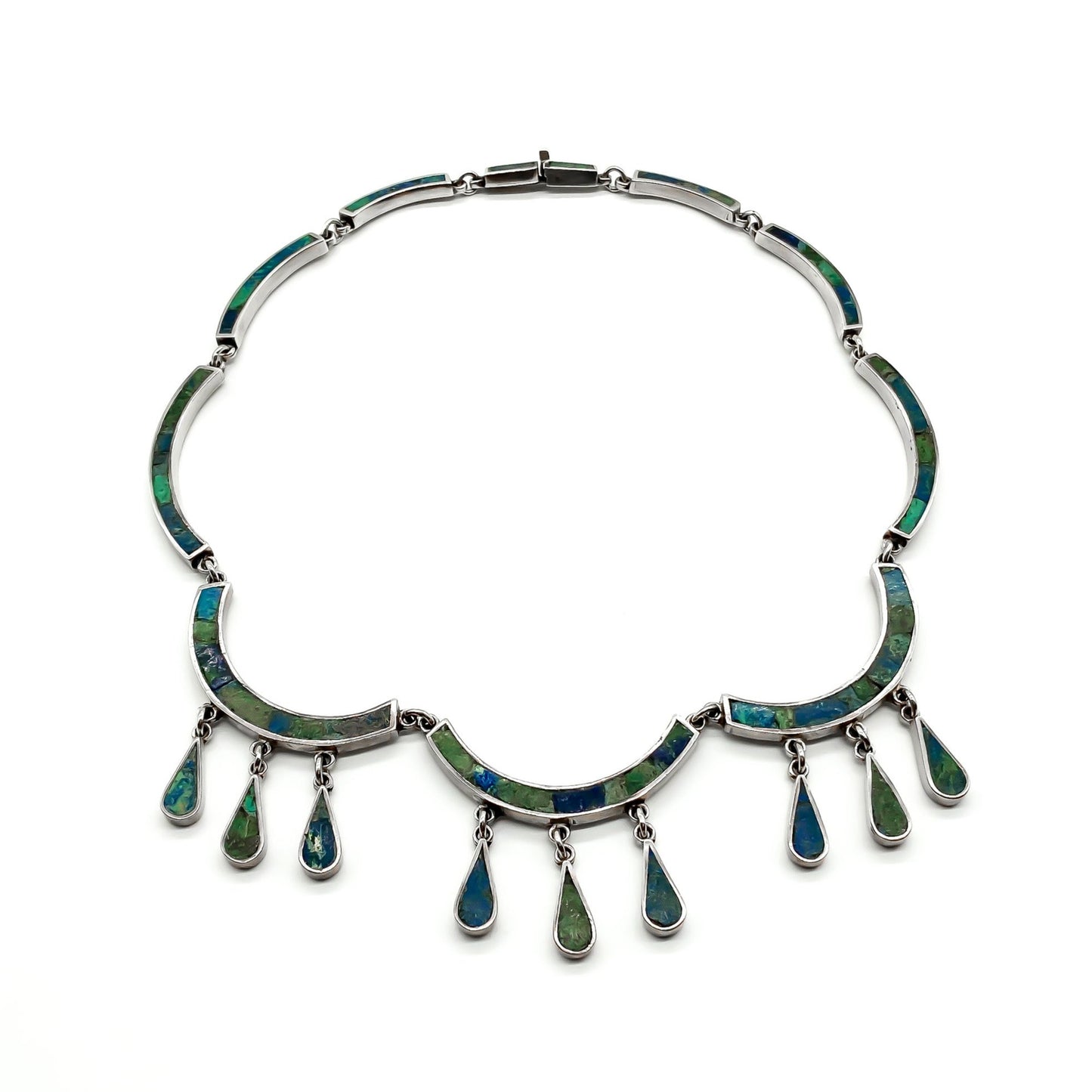 Ornate sterling silver Mexican necklace with deep green and blue crushed stone inlay and dangling drops. Designer: Los Castillo.  Eagle Hallmark (Post 1947) Taxco.