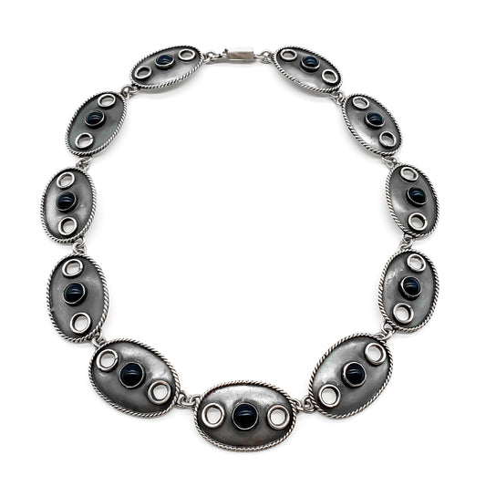 Stylish oxidised vintage sterling silver Mexican necklace consisting of eleven oval links, each set with a dark blue cabochon stone. Post 1980