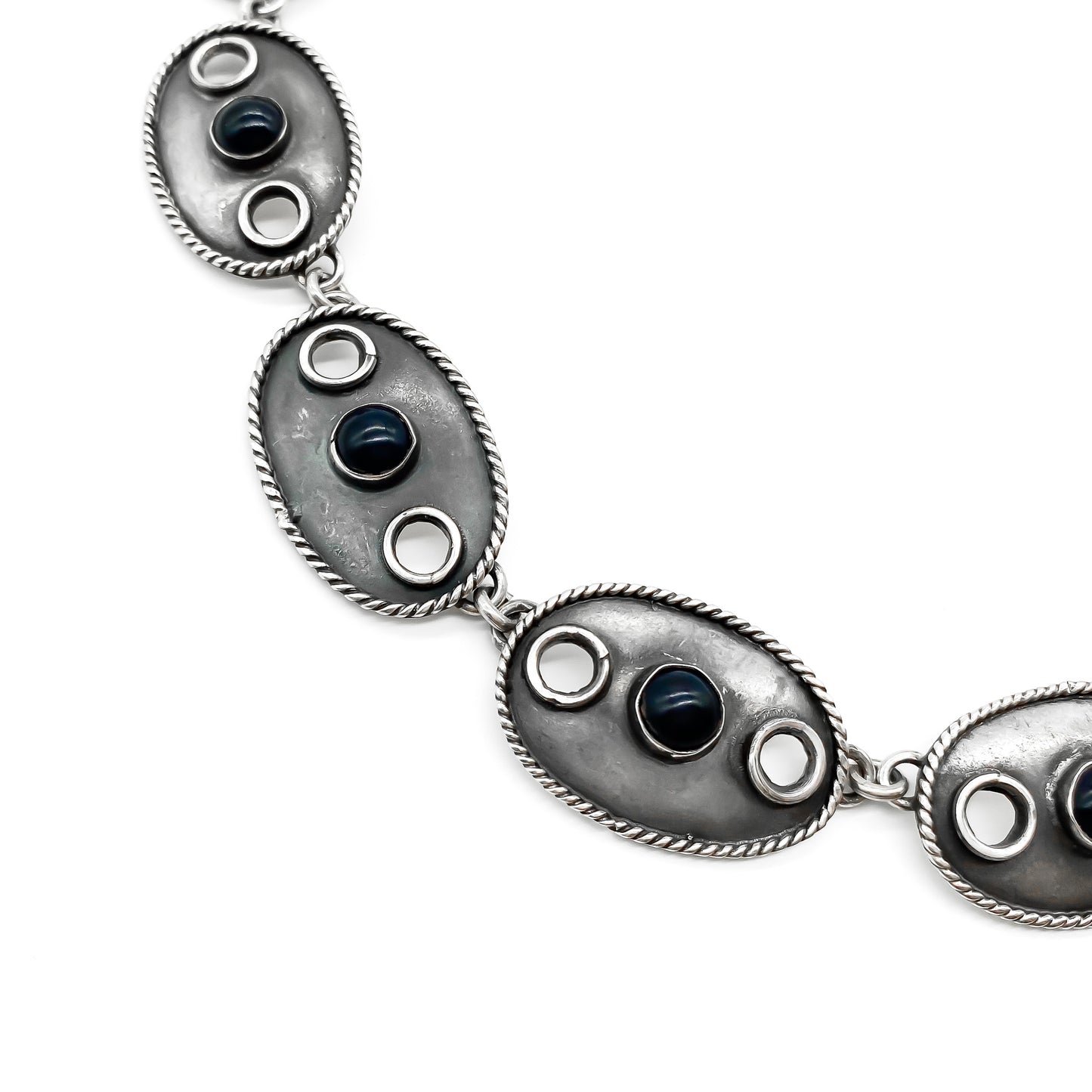 Stylish oxidised vintage sterling silver Mexican necklace consisting of eleven oval links, each set with a dark blue cabochon stone. Post 1980