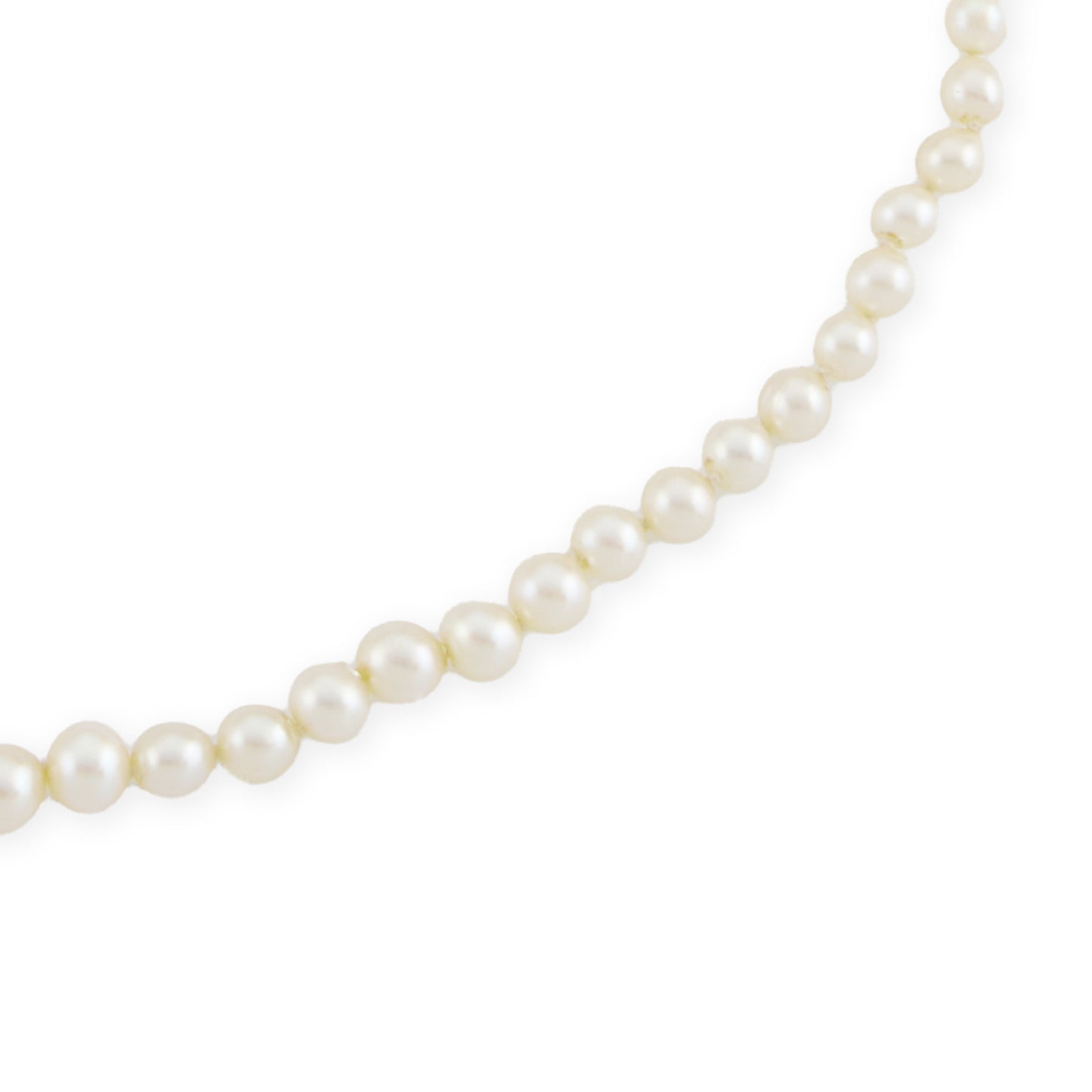 Graduated string of lustrous vintage cultured seawater pearls with sterling silver clasp set with a single pearl.