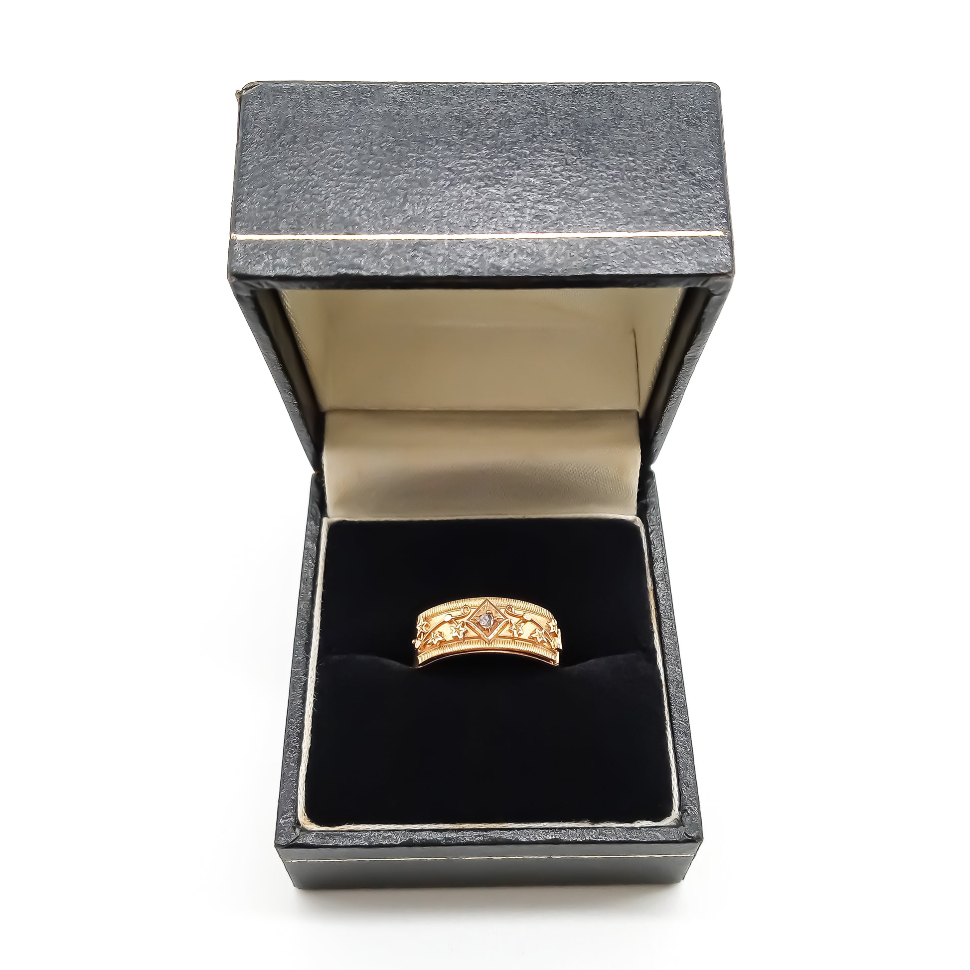 Rare 18ct gold Victorian REGARD ring set with a small mine-cut diamond and delicate leaf design in a black ring box.