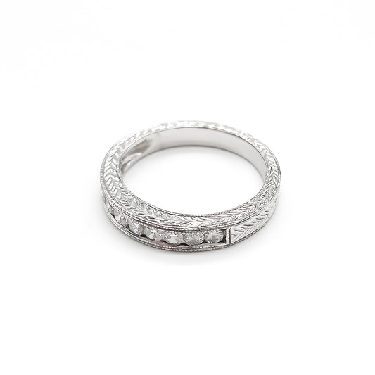 Classic 18ct white gold half eternity ring with eleven sparkling diamonds in a tube setting.