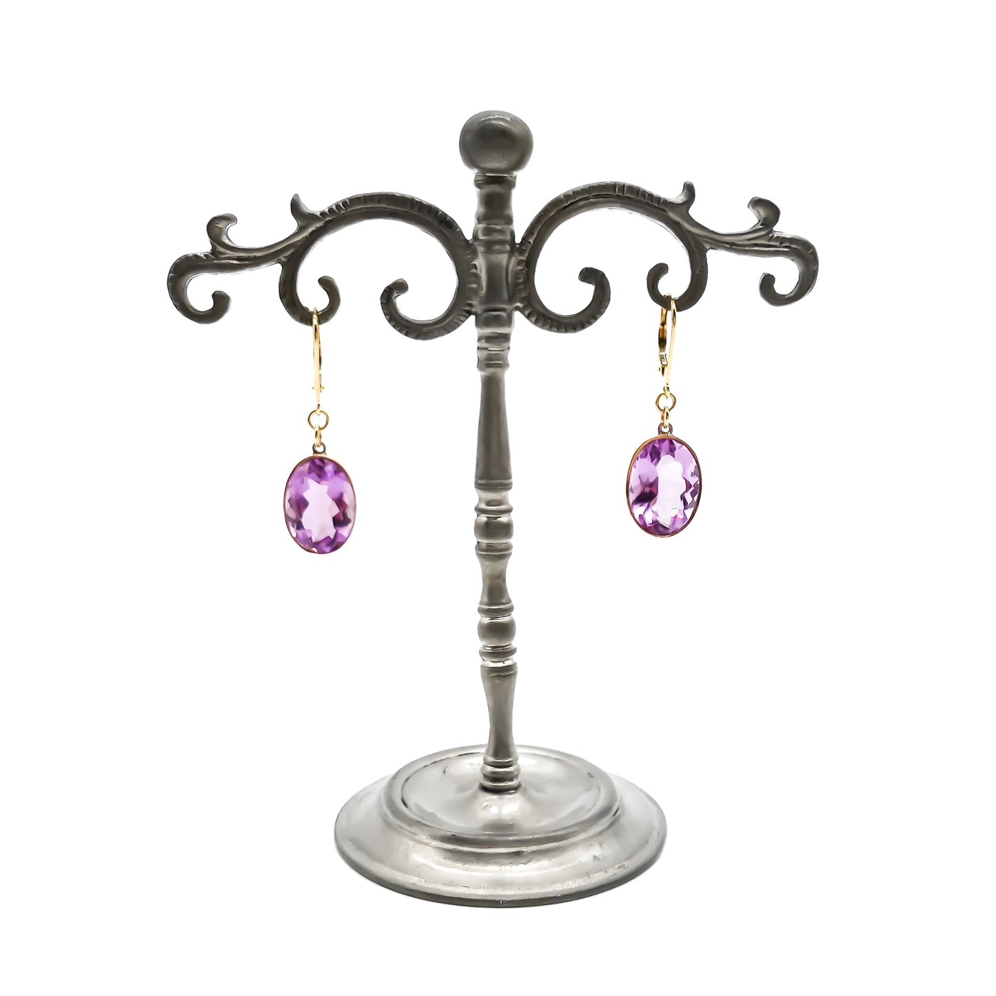Classic 9ct gold drop earrings set with beautifully faceted oval amethysts.