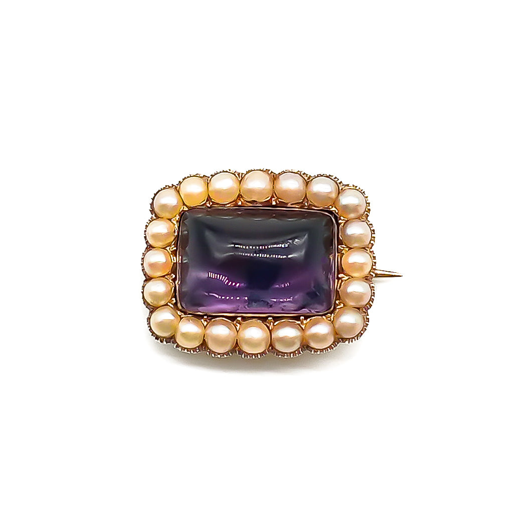 Lovely Georgian 15ct gold brooch set with a cabochon amethyst, surrounded by twenty lustrous seed pearls.