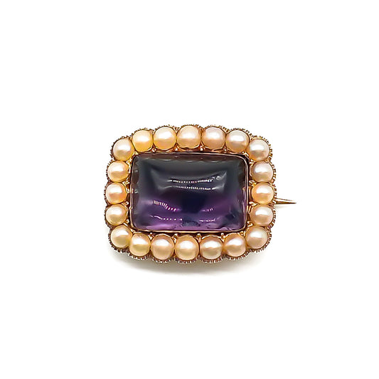 Lovely Georgian 15ct gold brooch set with a cabochon amethyst, surrounded by twenty lustrous seed pearls.
