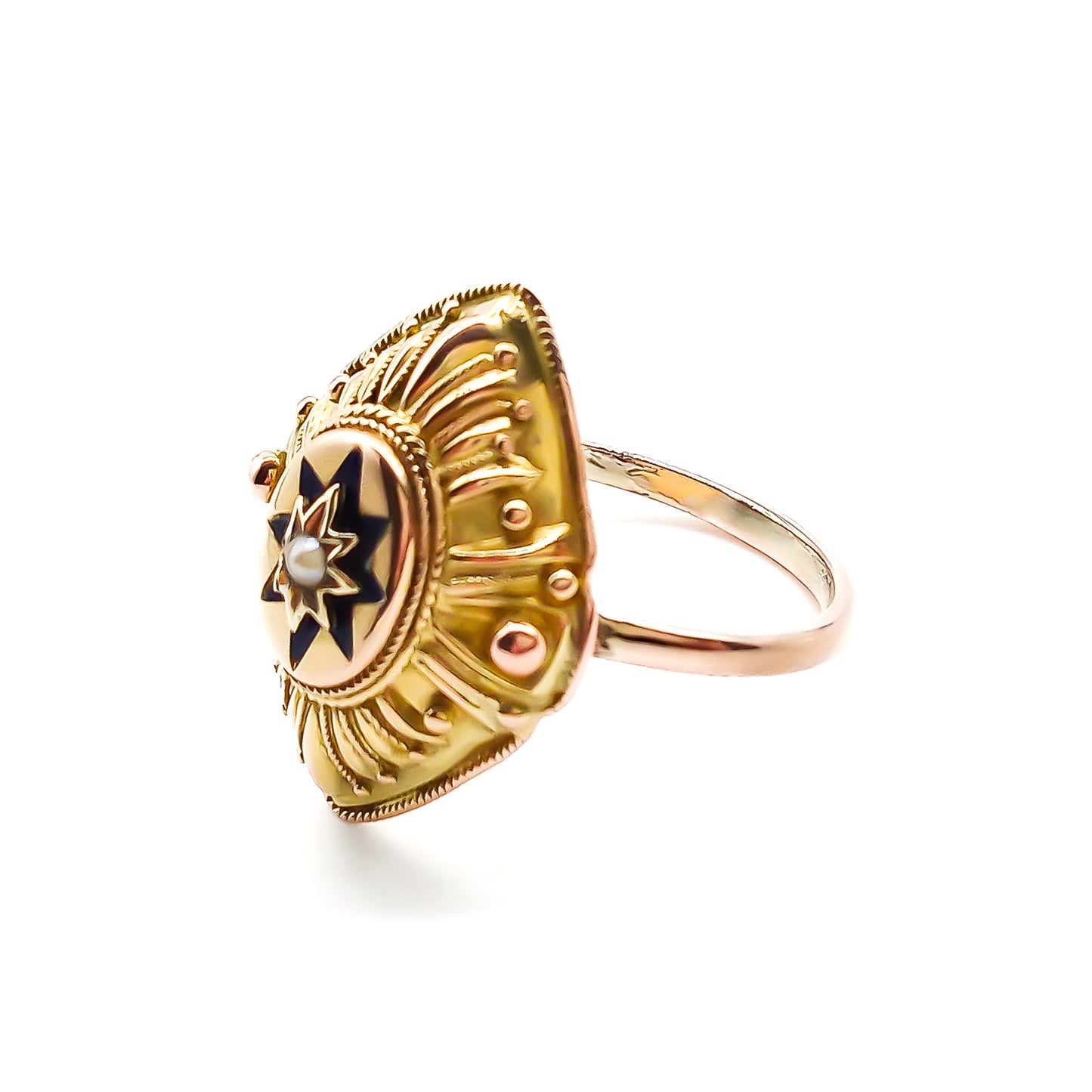 Lovely 15ct yellow gold Victorian ring with ornate detail. The ring is set with a single seed pearl, surrounded by dark blue enamelling in the shape of a star. Later shank.