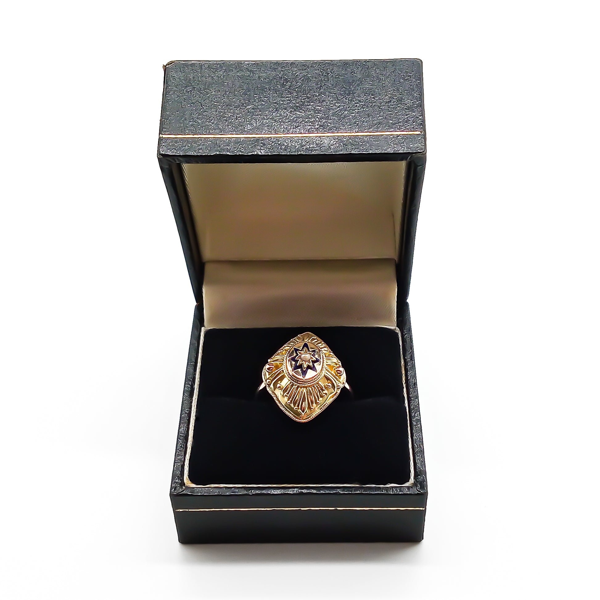 Lovely 15ct yellow gold Victorian ring with ornate detail. The ring is set with a single seed pearl, surrounded by dark blue enamelling in the shape of a star. Later shank.