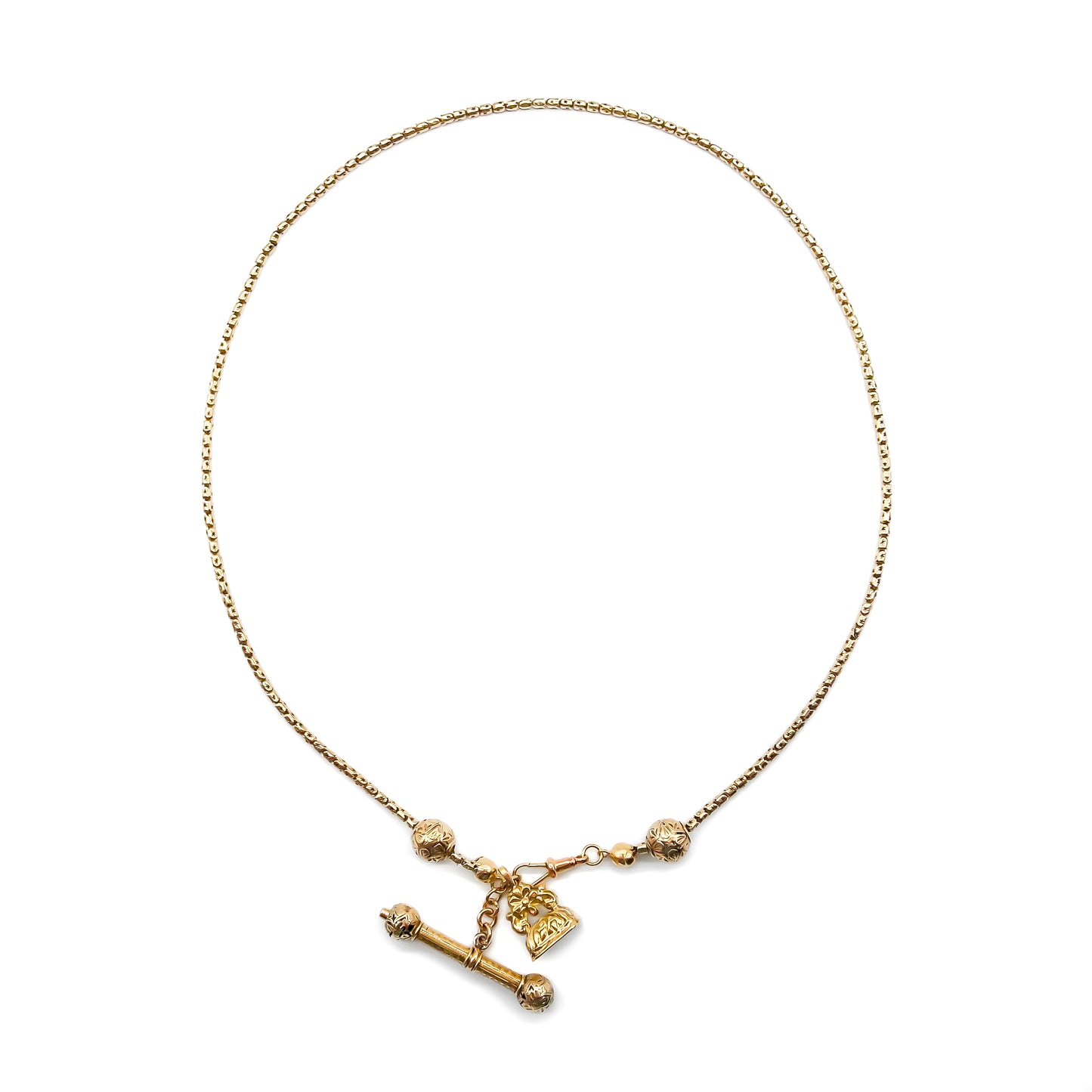 Lovely 9ct gold Victorian rope link chain with an ornate seal, t-bar, round sliders and a dog-clip.
