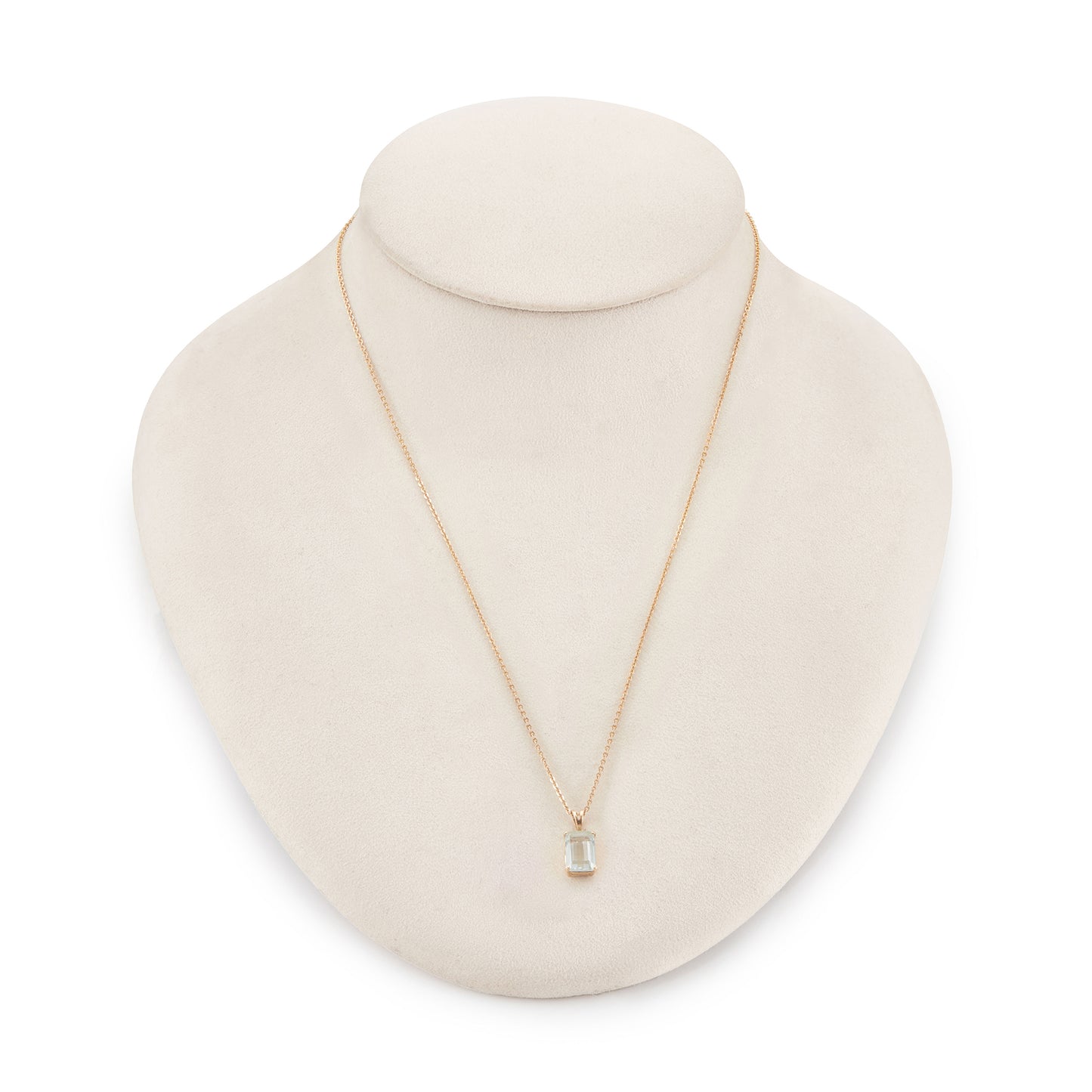 Lovely emerald-cut aquamarine in a 14ct gold pendant setting, on a 9ct gold chain.