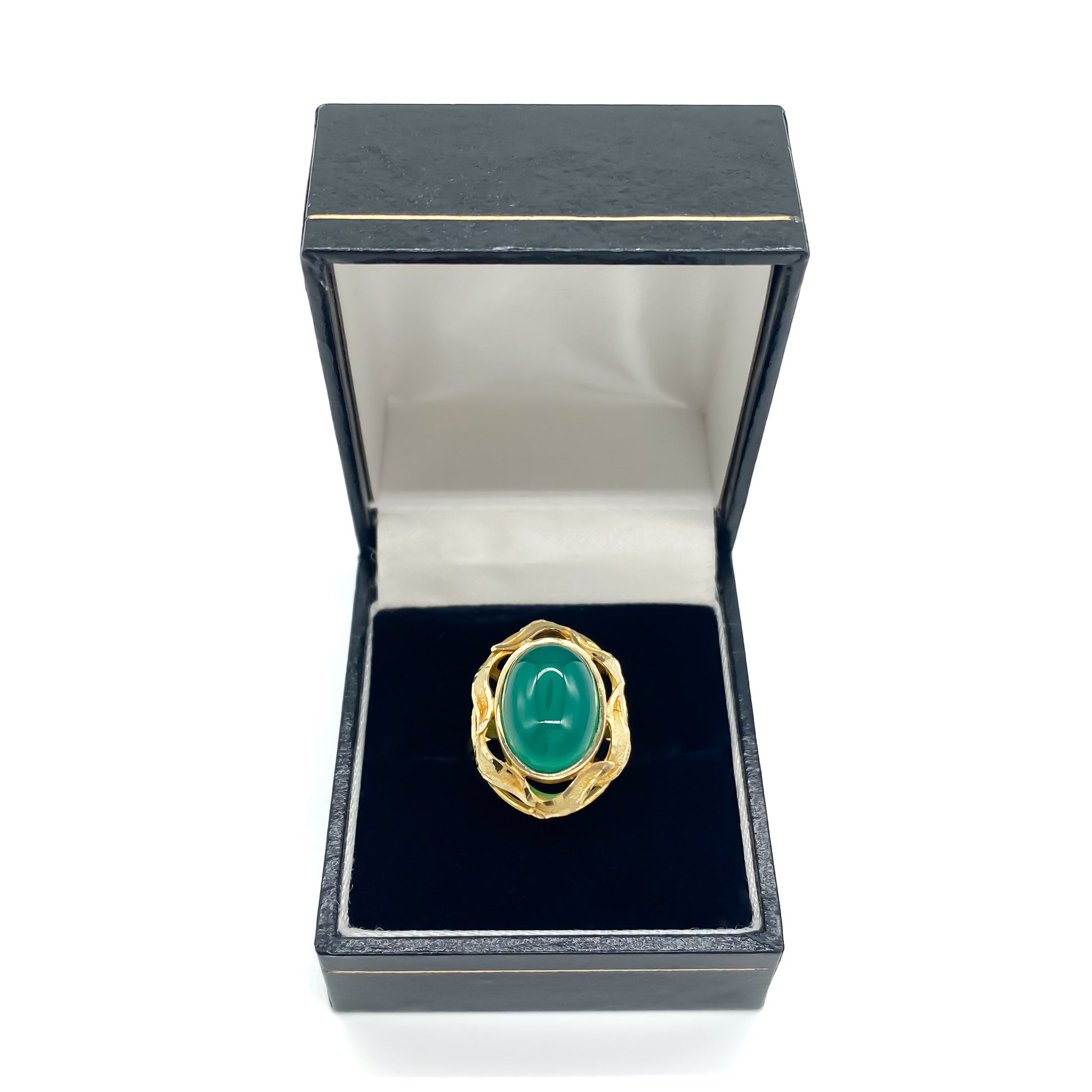 Stunning 14ct yellow gold ring set with a bright green oval chrysoprase cabochon, surrounded by a textured gold border.