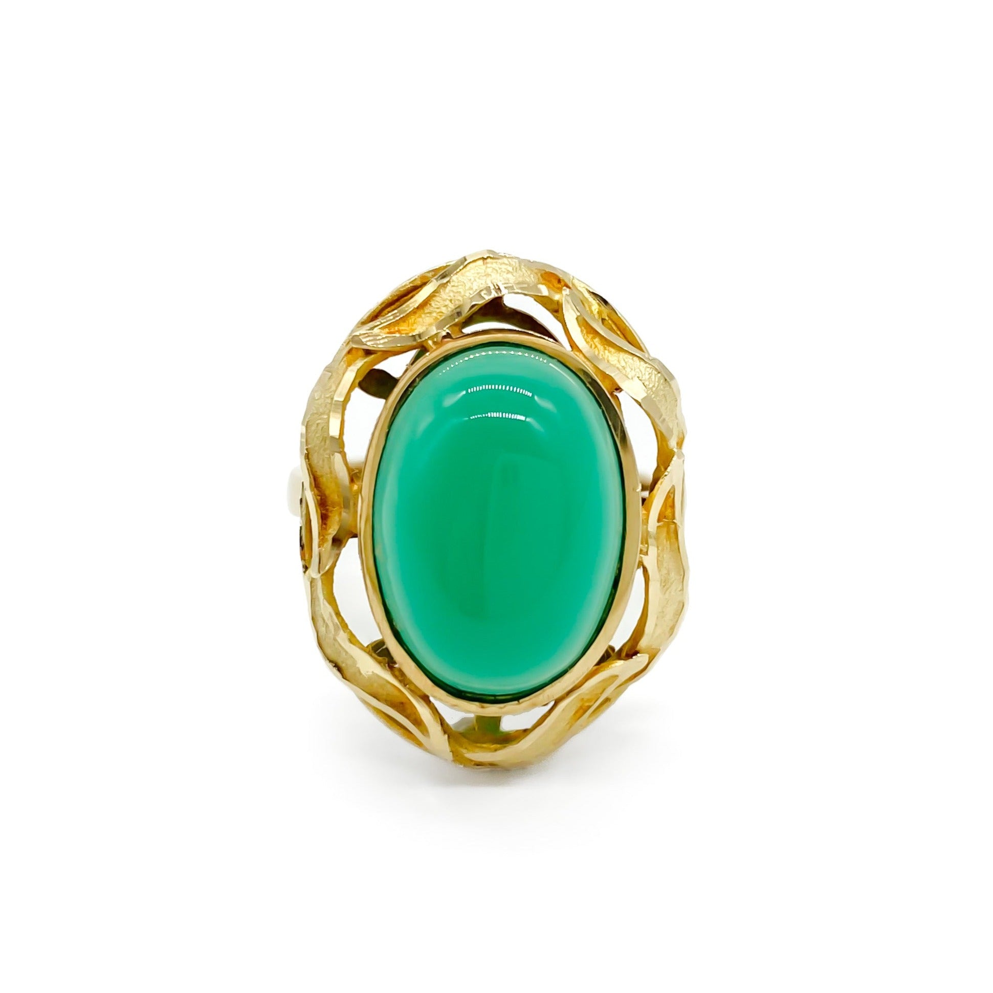 Stunning 14ct yellow gold ring set with a bright green oval chrysoprase cabochon, surrounded by a textured gold border.