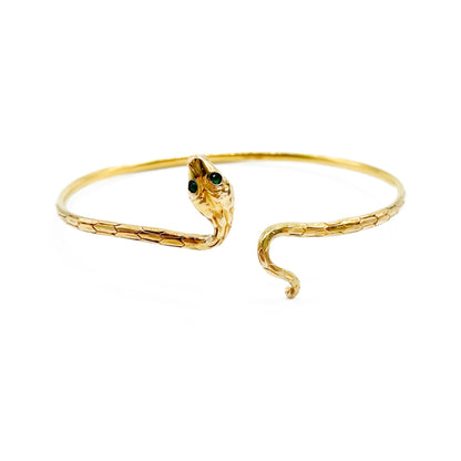 Charming 14ct gold serpent bangle with scale engraving and emerald eyes. Circa 1930's