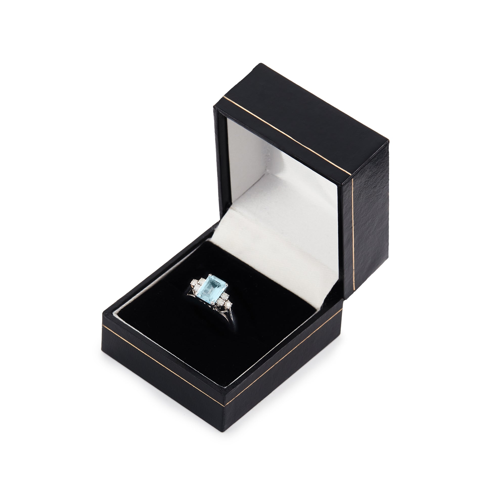 Classic vintage 14ct white gold ring set with a light blue emerald-cut aquamarine flanked by three 0.05ct diamonds on each side. Size: M½