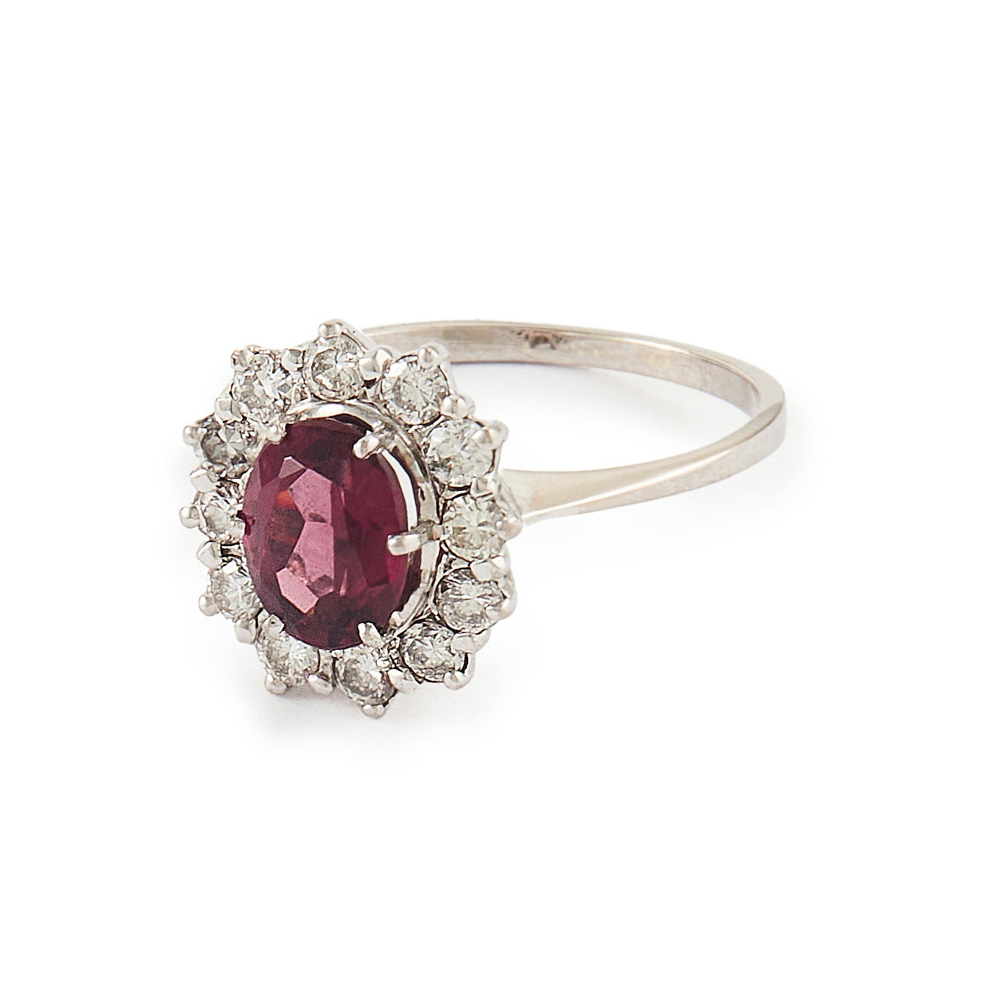 Exquisite vintage 14ct white gold ring set with a beautiful ruby-coloured rhodolite garnet surrounded by twelve natural 0.6ct diamonds.