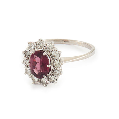 Exquisite vintage 14ct white gold ring set with a beautiful ruby-coloured rhodolite garnet surrounded by twelve natural 0.6ct diamonds.