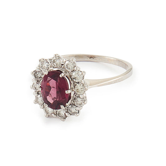 Exquisite vintage 14ct white gold ring set with a beautiful ruby-coloured rhodolite garnet surrounded by twelve natural 0.6ct diamonds.